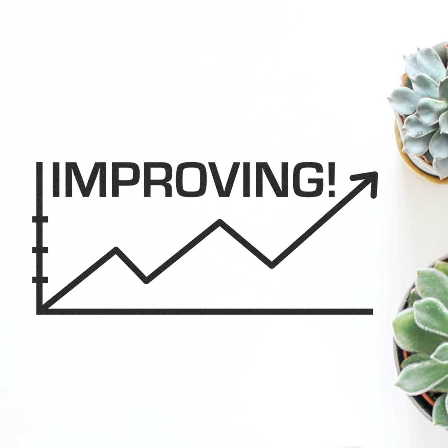 Slim Pre-Inked Improving with Chart Icon Stamp showing an upward trend graph with IMPROVING! text, placed beside potted succulents.