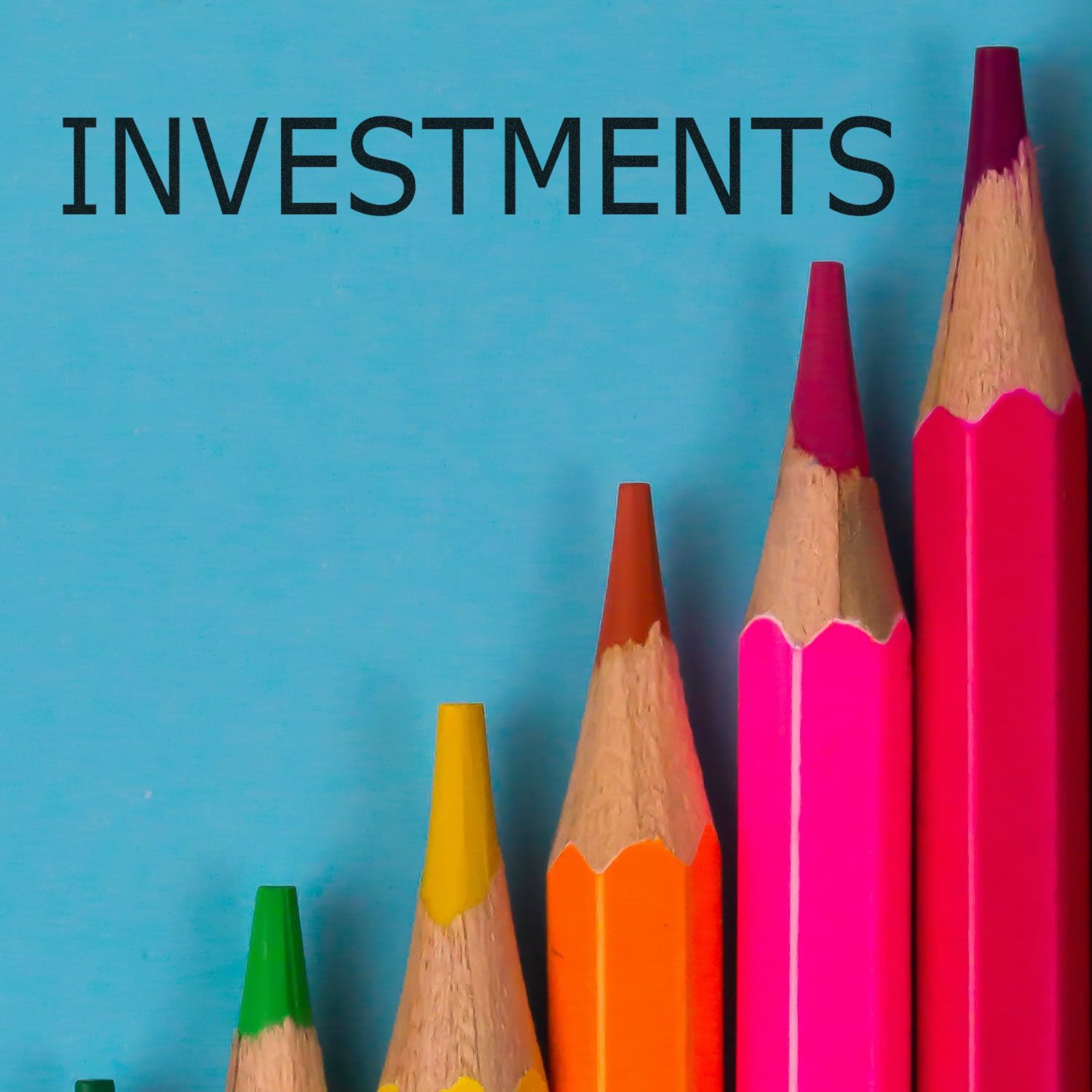 Colorful pencils arranged in ascending order with the text INVESTMENTS above them, showcasing the Investments Rubber Stamp.