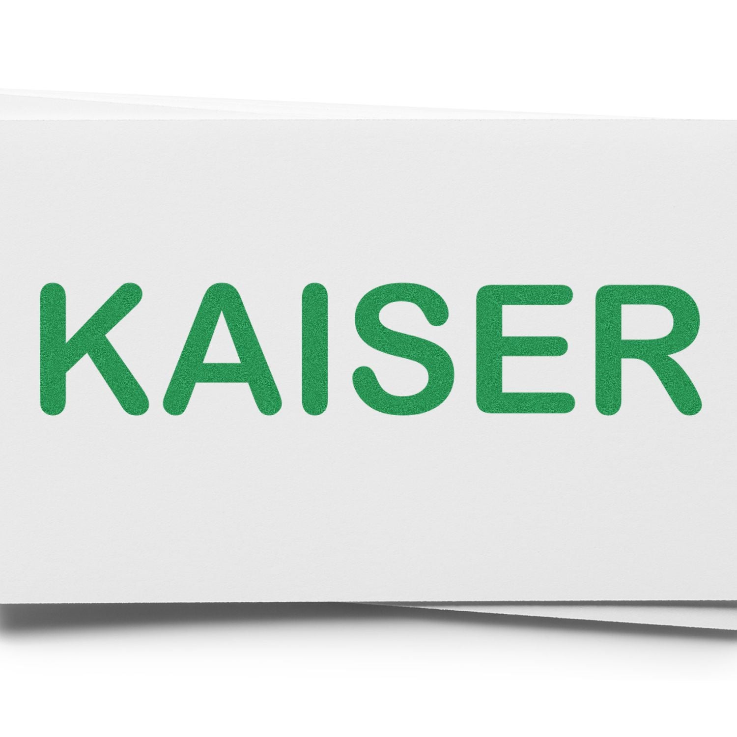 Medical Kaiser Rubber Stamp imprinting the word 'KAISER' in green ink on a white surface.