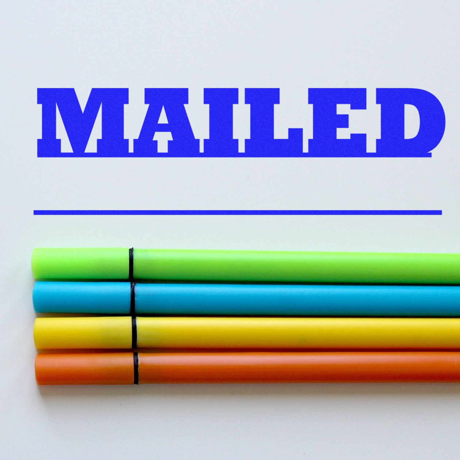 Mailed with Date Line Rubber Stamp in blue ink above four colorful markers on a white background.