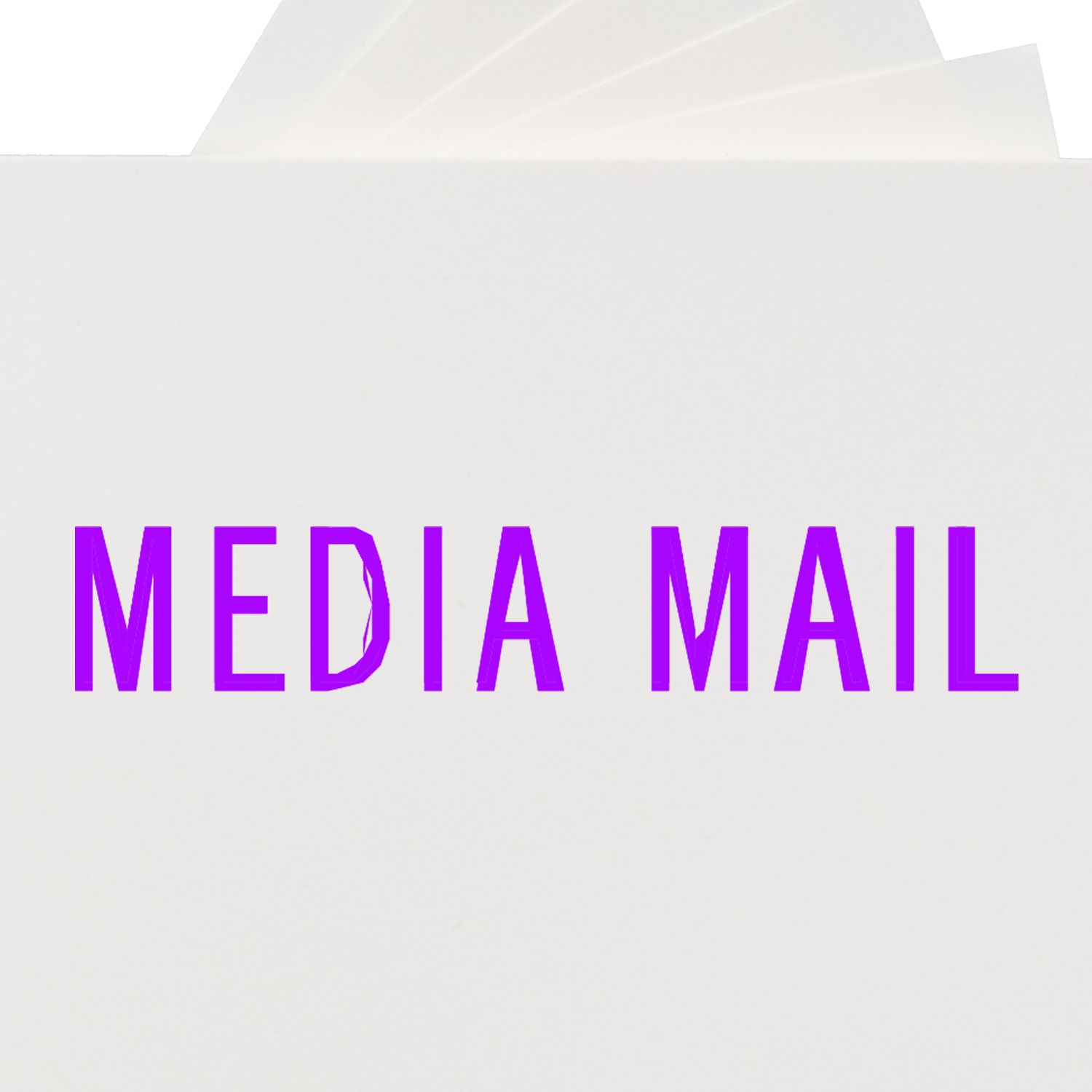 Media Mail rubber stamp in purple ink on white paper, with the words 'MEDIA MAIL' clearly visible.