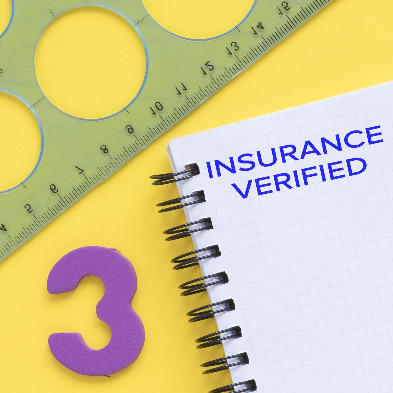 Narrow Font Insurance Verified Rubber Stamp on a notebook with a ruler and a purple number three on a yellow background.