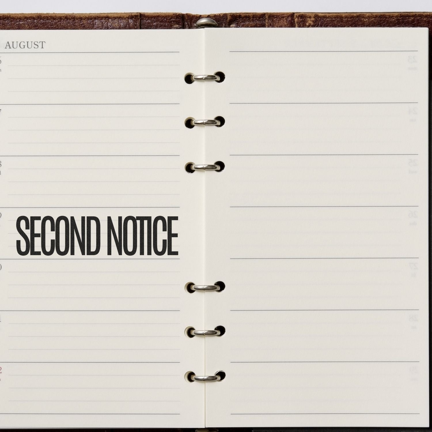 Large Self Inking Narrow Font Second Notice Stamp used on an open planner, displaying the text SECOND NOTICE in bold black letters.