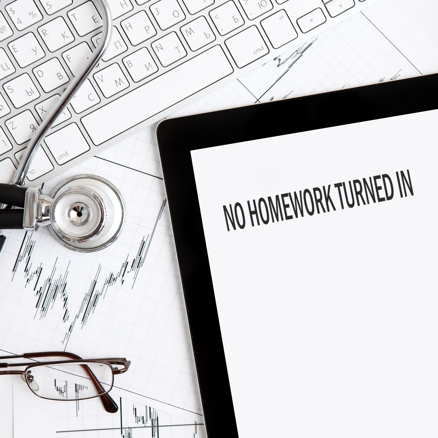 No Homework Turned In rubber stamp on a tablet screen, surrounded by a keyboard, stethoscope, and glasses on a desk.