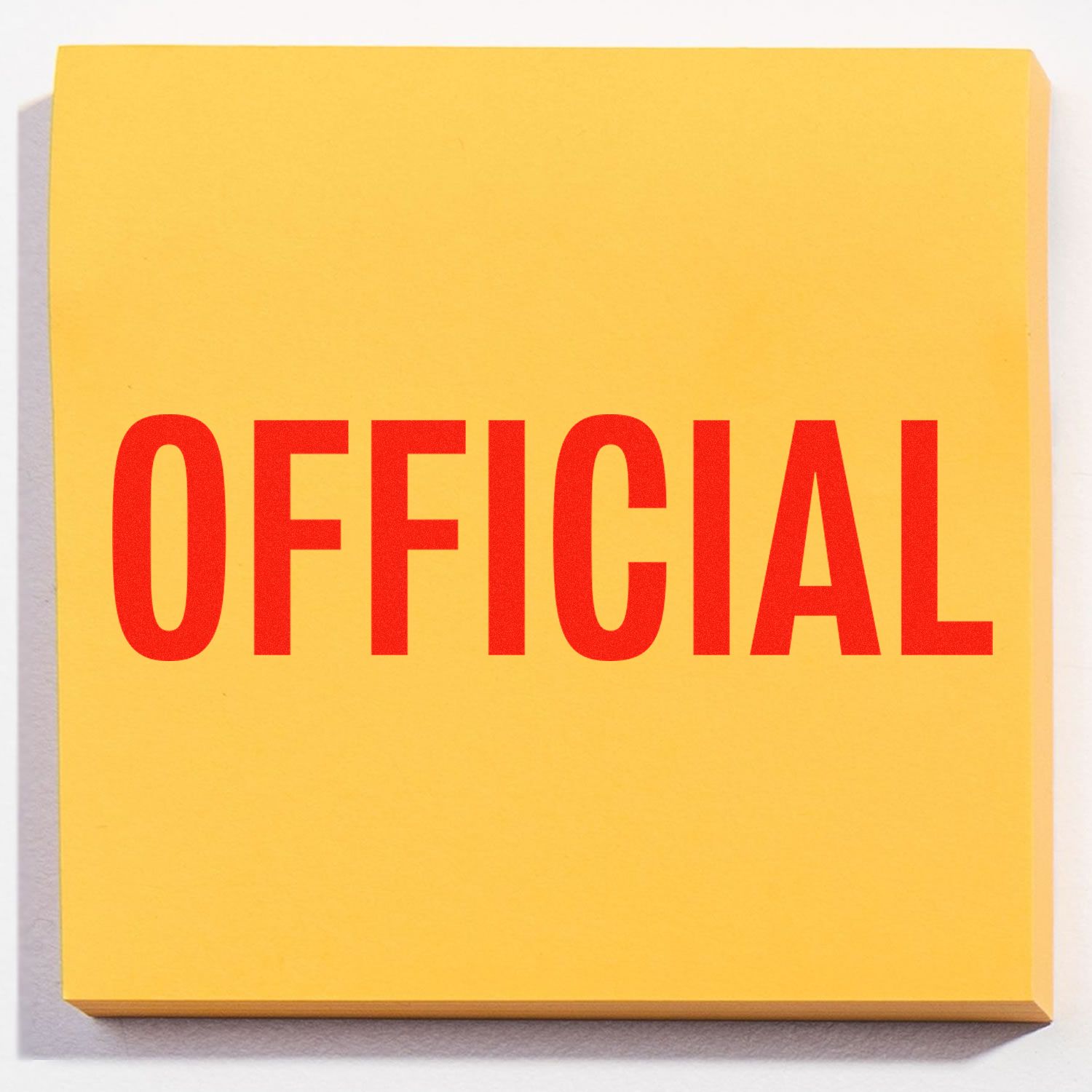 Yellow sticky note with the word OFFICIAL stamped in bold red letters, representing an official rubber stamp imprint.