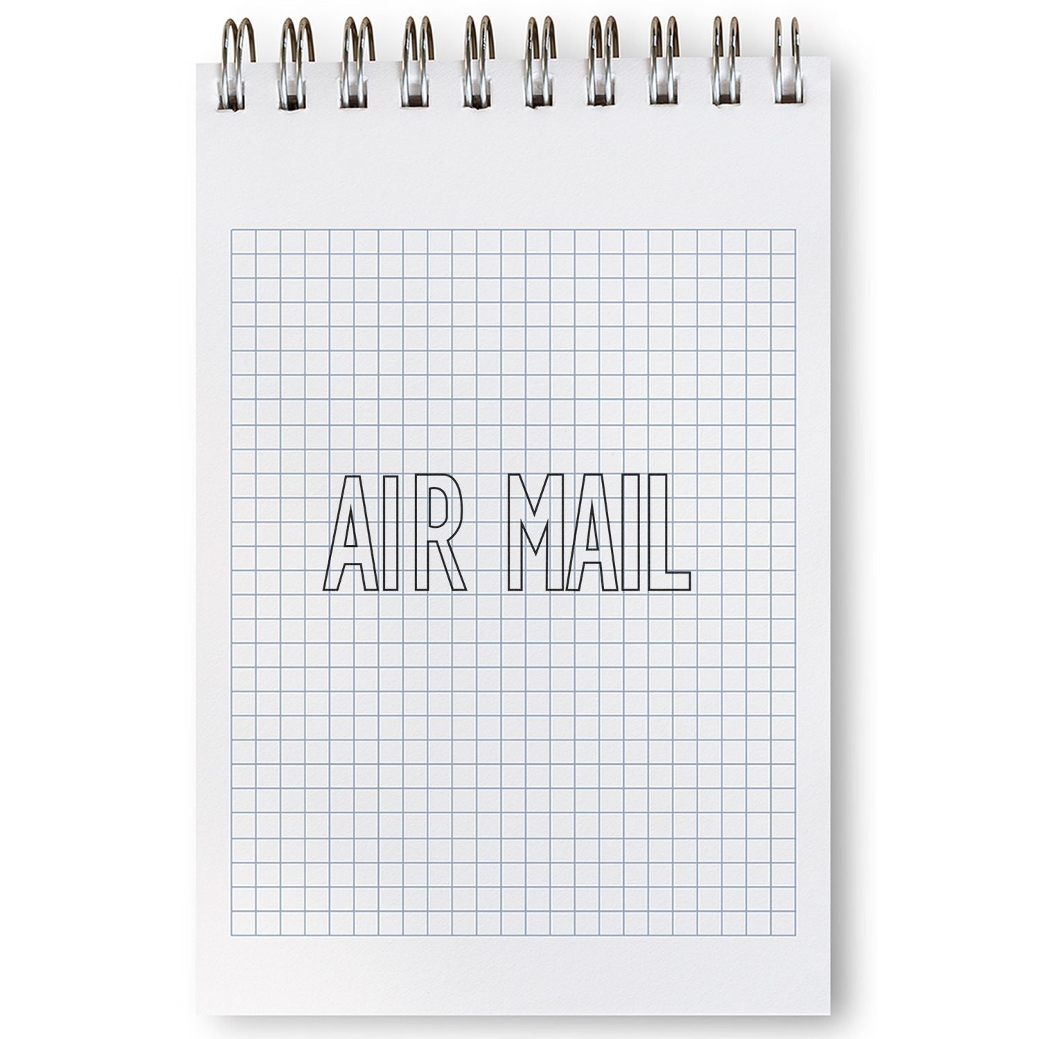 Spiral notebook with grid paper featuring an Outline Air Mail Rubber Stamp design in the center.