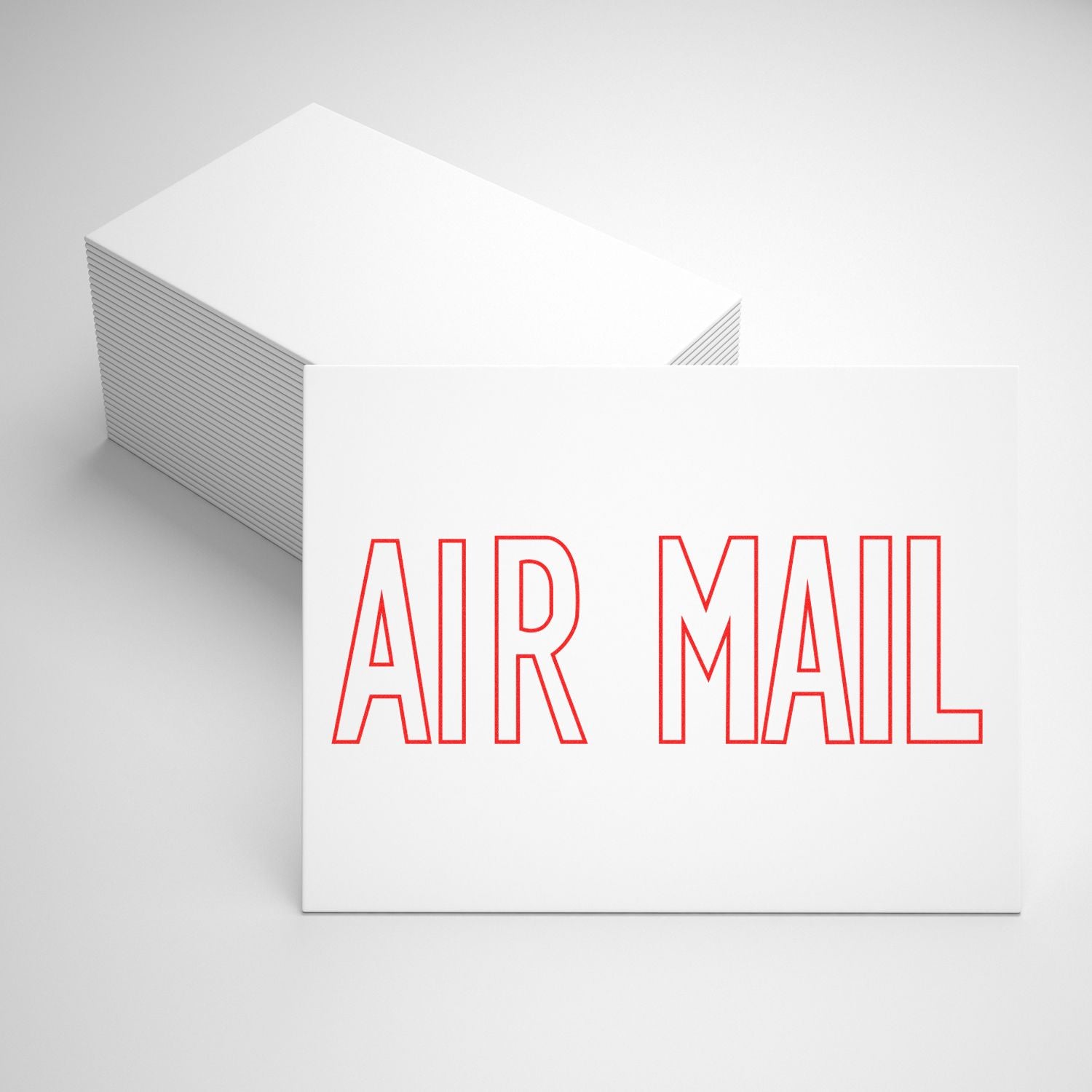 Stack of white cards with AIR MAIL in red outline text, showcasing the Outline Air Mail Rubber Stamp design.