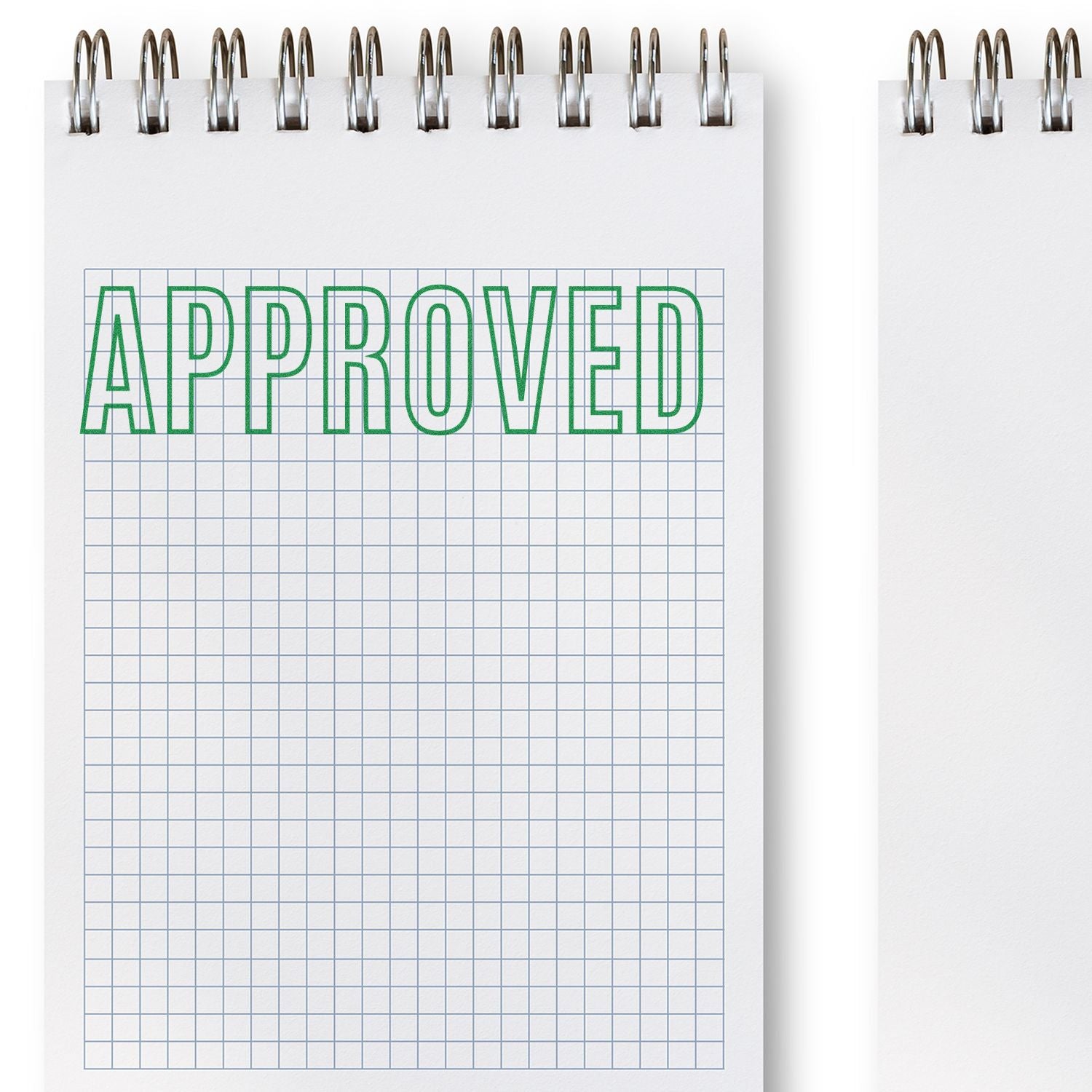 Slim Pre-Inked Outline Approved Stamp used on a grid notebook, displaying the word APPROVED in green outline letters.