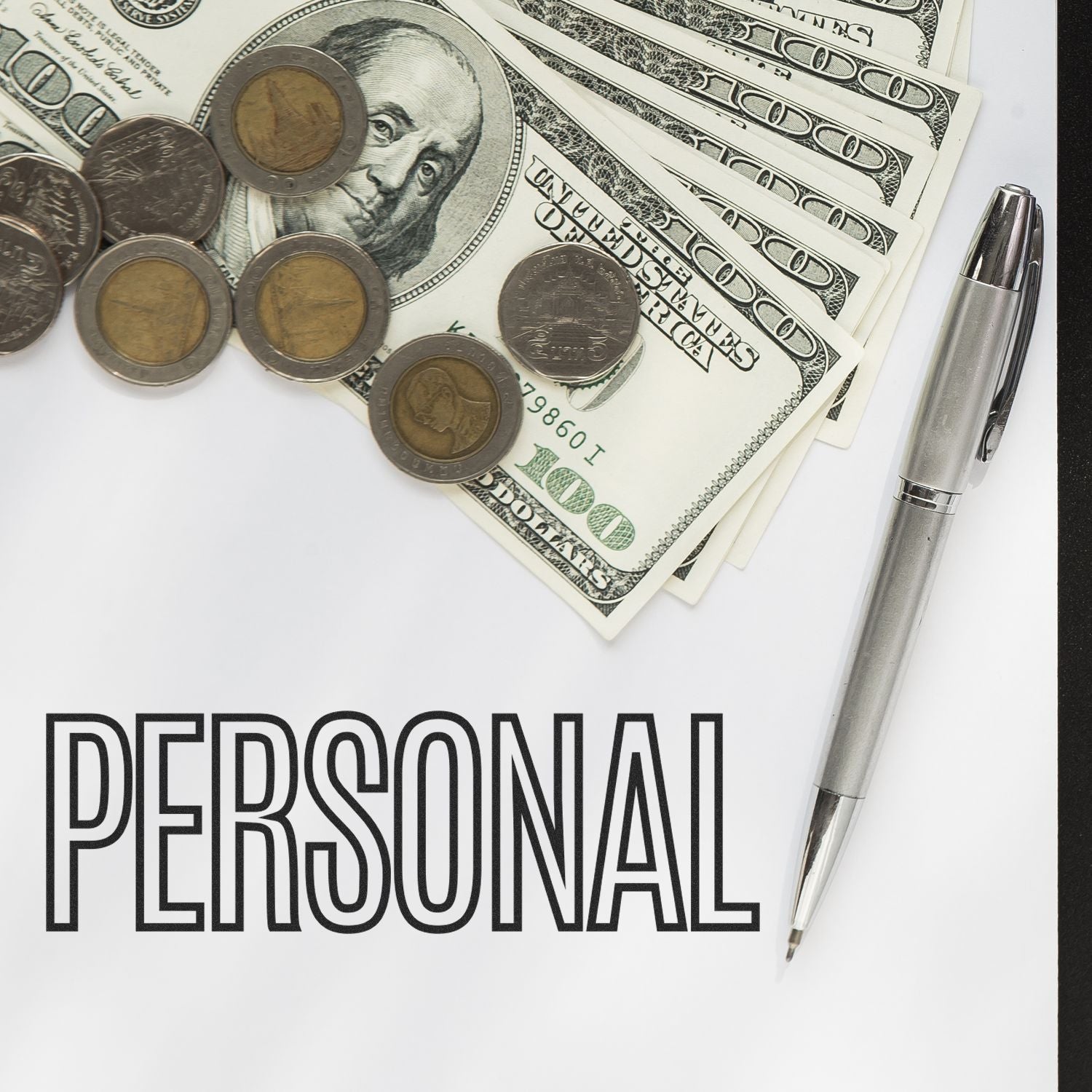 Outline Personal Rubber Stamp on paper with the word 'PERSONAL,' next to a pen, coins, and dollar bills.