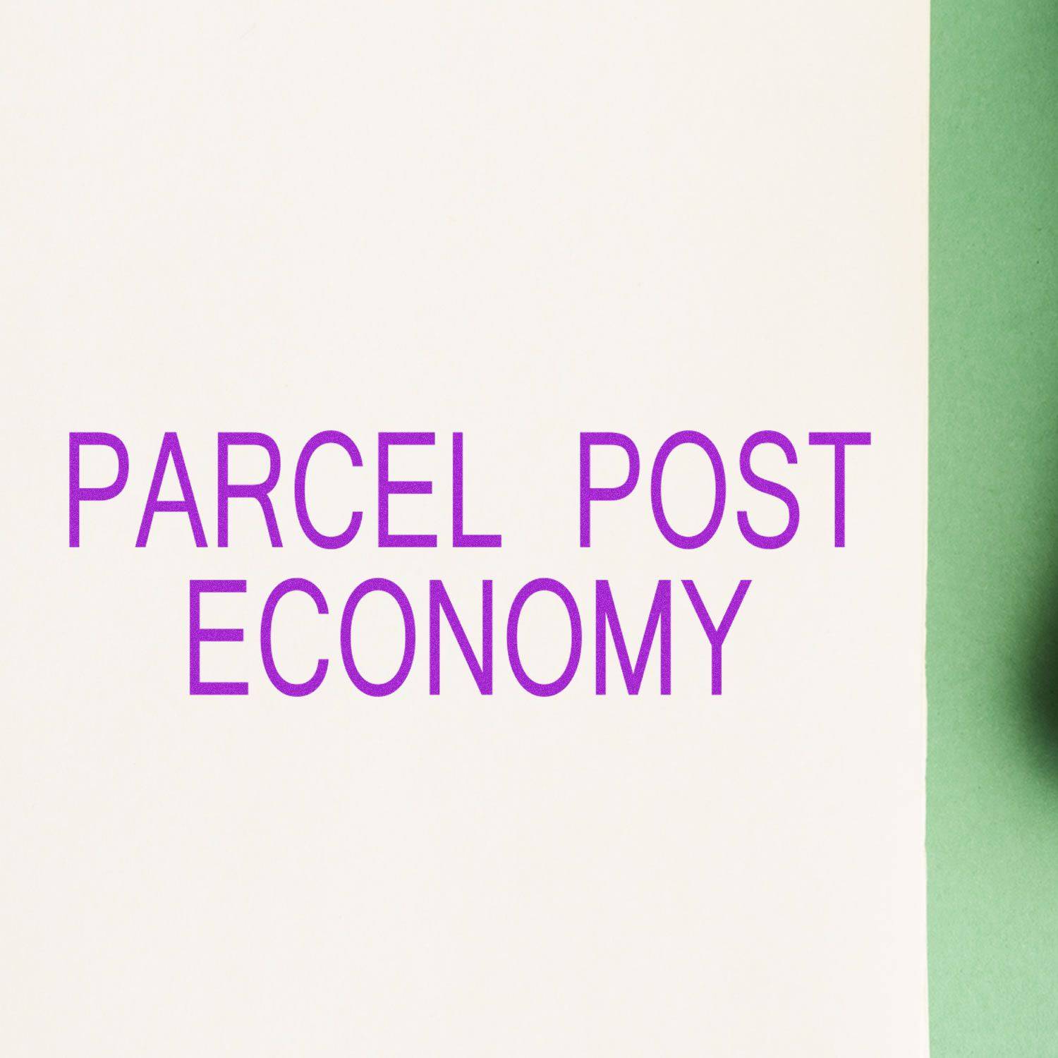 Large Parcel Post Economy Rubber Stamp in use, displaying bold purple text PARCEL POST ECONOMY on a white and green background.