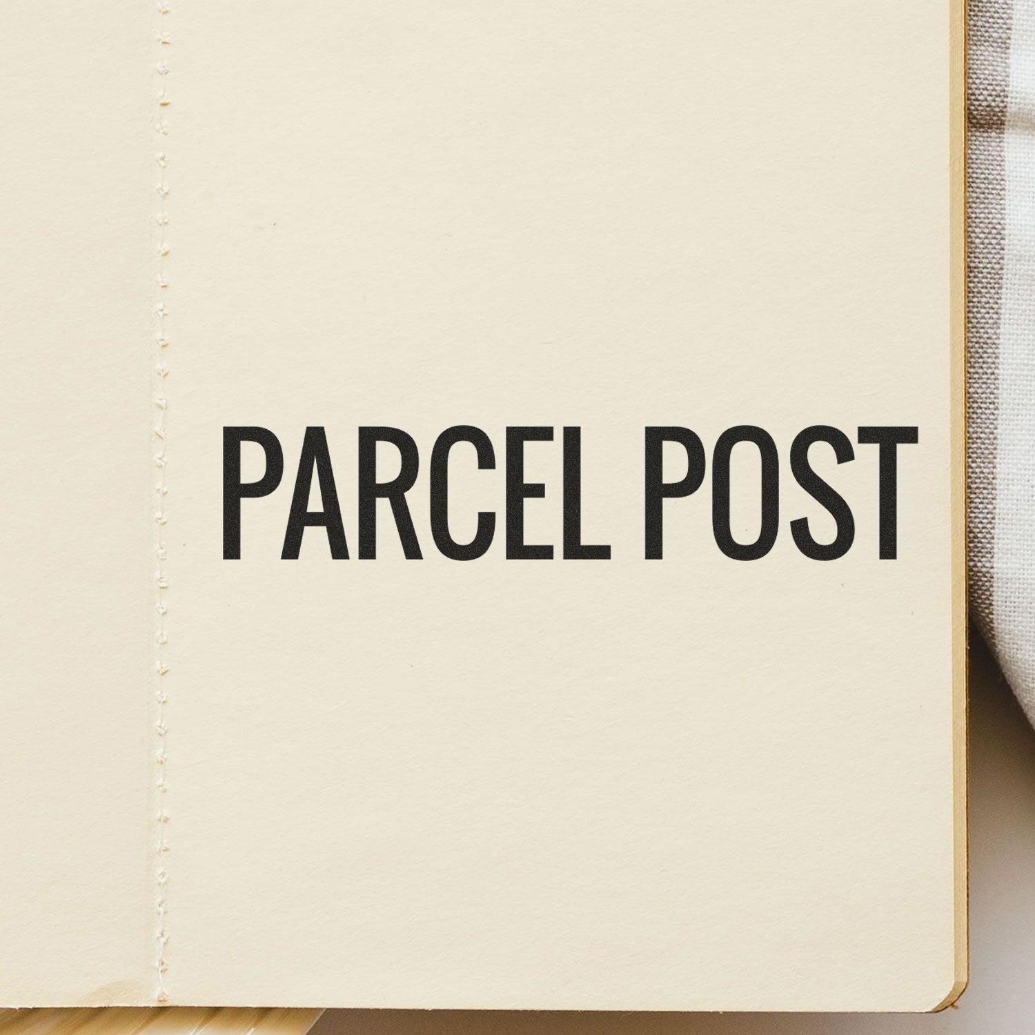 Self Inking Parcel Post Stamp imprint on a beige paper, displaying the text PARCEL POST in bold black letters.