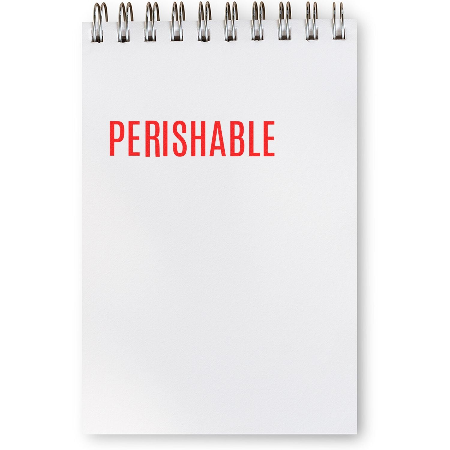 A spiral notepad with the word "PERISHABLE" stamped in red using a Perishable Rubber Stamp.