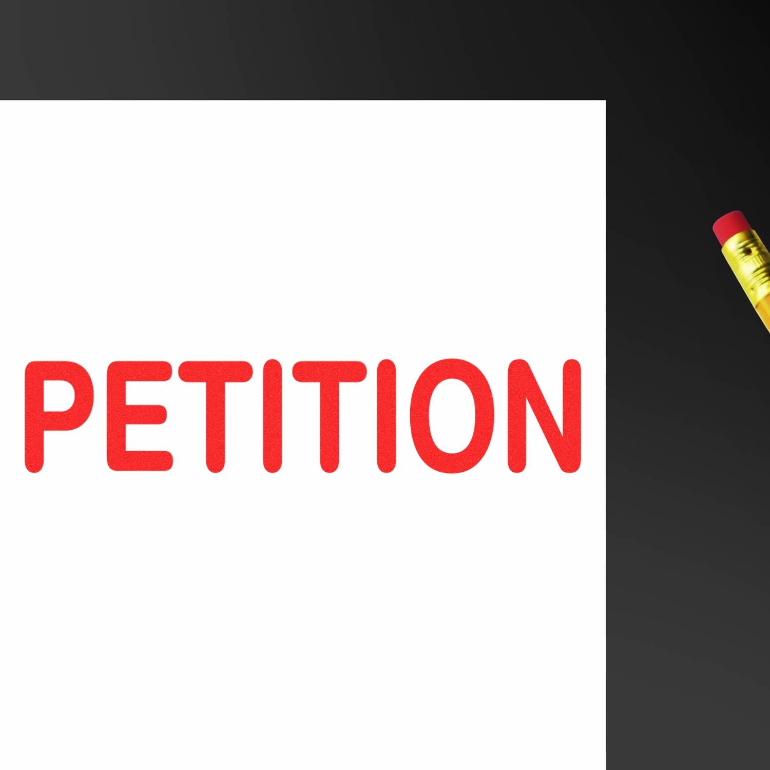 Red PETITION rubber stamp mark on white paper, with a pencil's eraser visible in the top right corner.