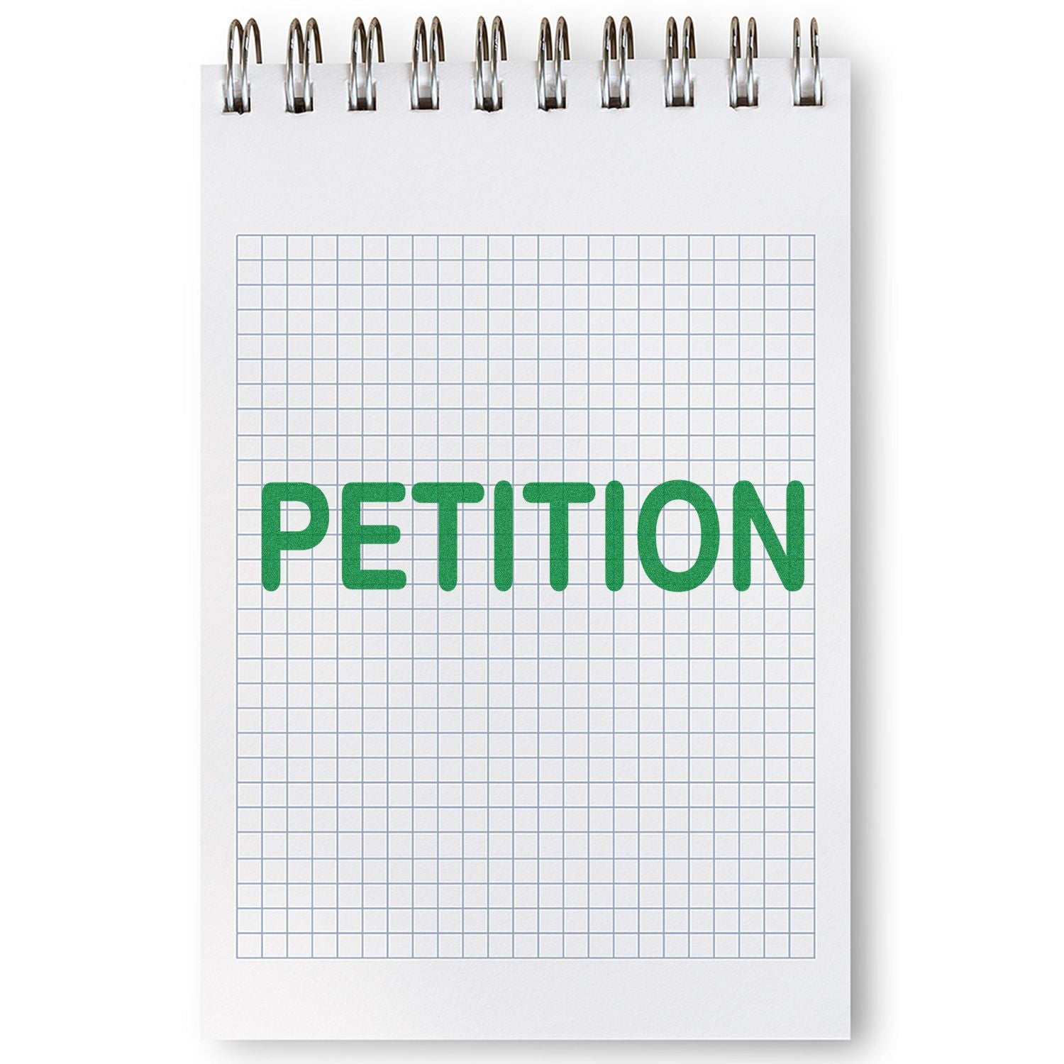 A Large Petition Rubber Stamp imprinting the word PETITION in green ink on a spiral-bound notebook with graph paper.