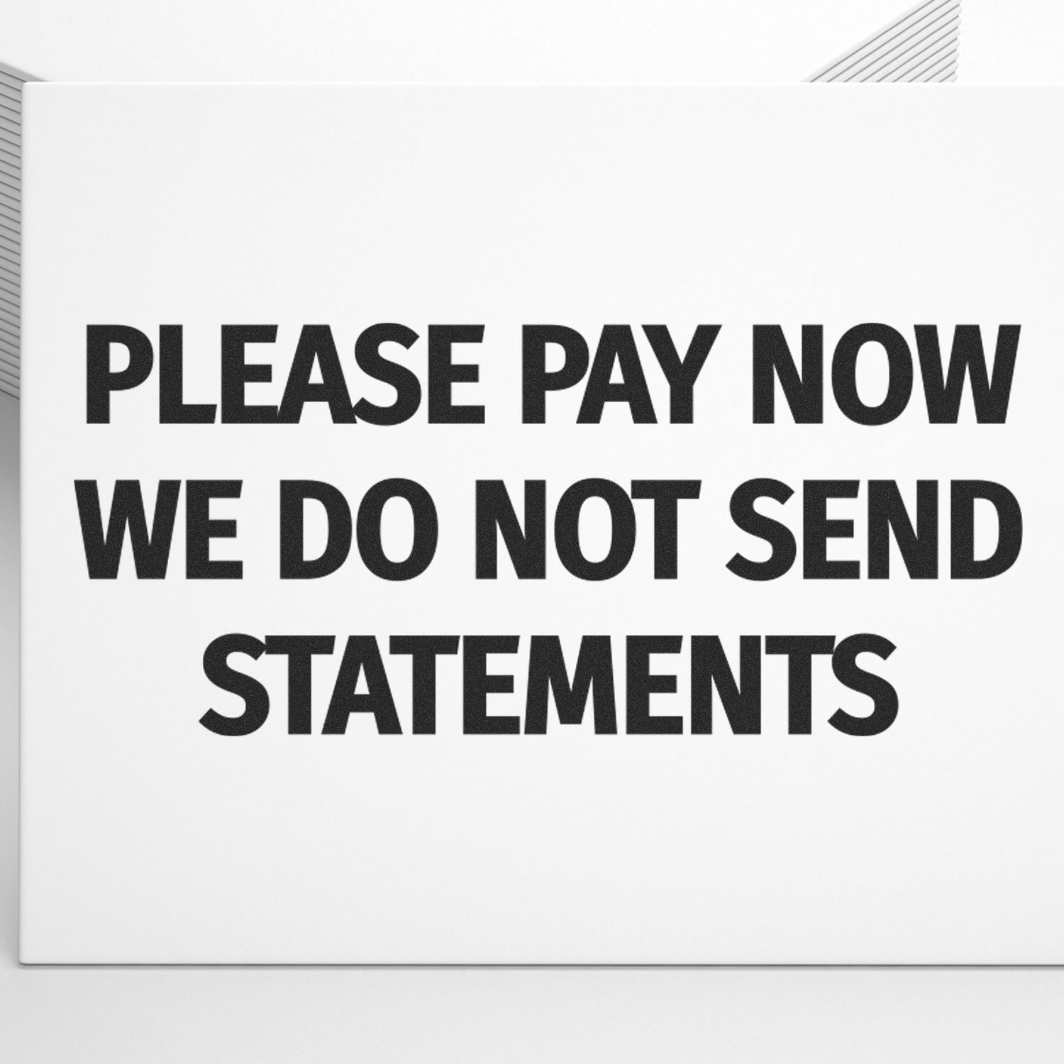 Slim Pre-Inked Please Pay Now No Statements will be Sent Stamp in use, displaying bold text on a white background.