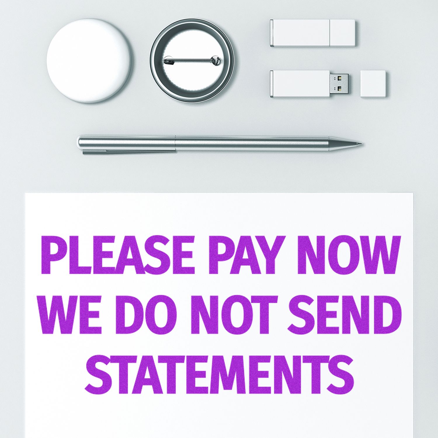 Large Please Pay Now No Statements will be Sent Rubber Stamp used on white paper, surrounded by office supplies.