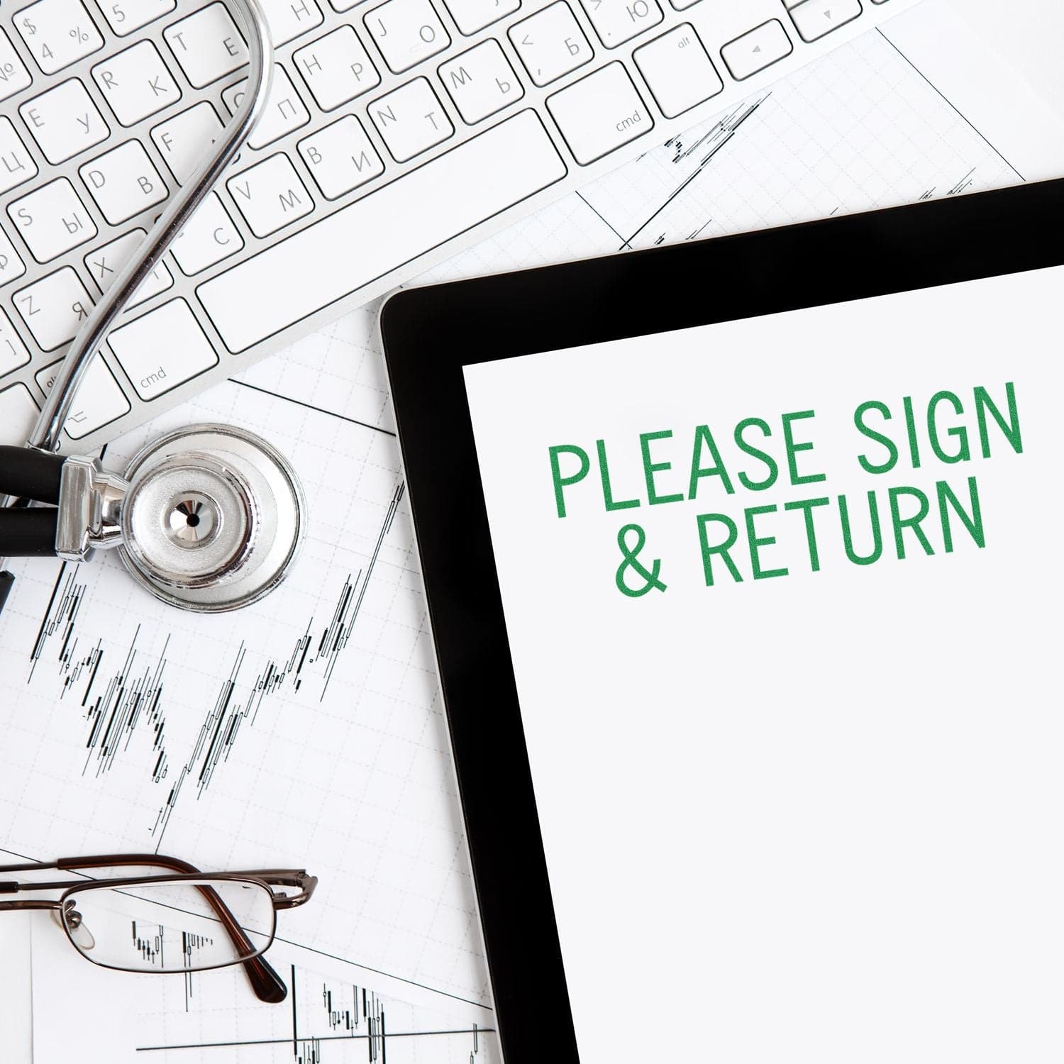 A Large Please Sign & Return Rubber Stamp is shown on a tablet screen, surrounded by a keyboard, stethoscope, glasses, and financial charts.