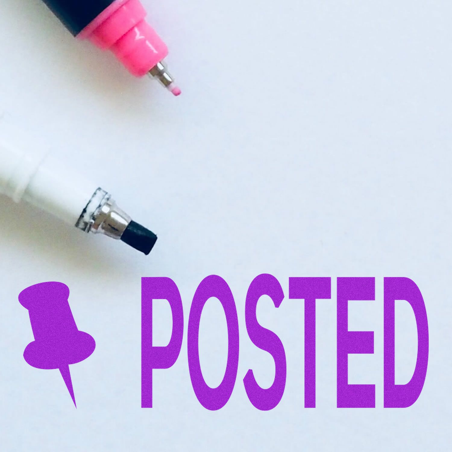 Large Self Inking Posted with Thumbtack Stamp in use, showing a purple 'POSTED' mark with a thumbtack icon next to two markers on white paper.