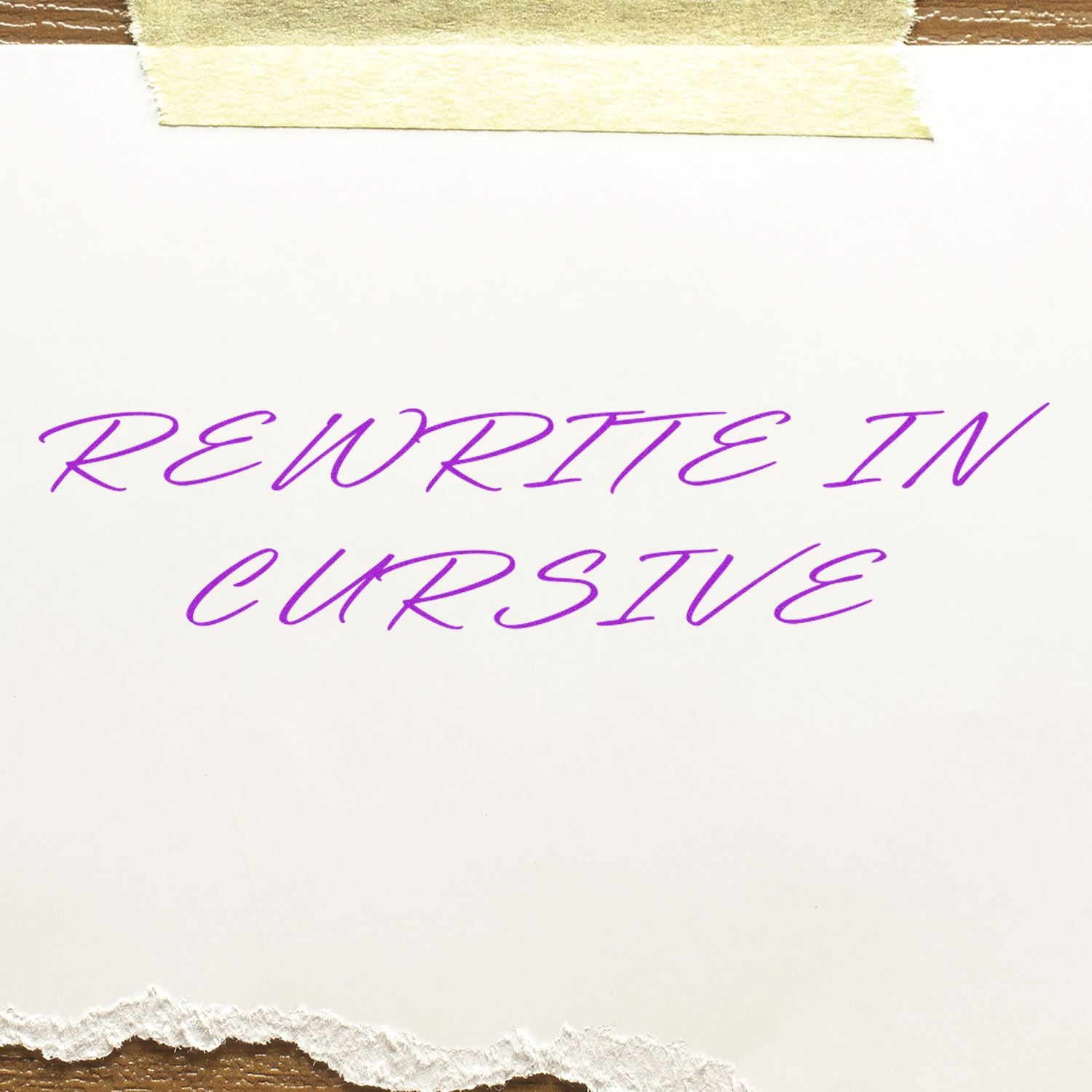 A rubber stamp impression with the text 'Rewrite In Cursive' in purple cursive font on a torn piece of white paper.