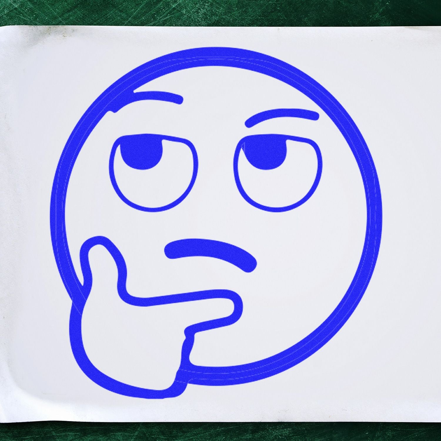 Round Curious Smiley Rubber Stamp in blue ink on white paper, depicting a thinking face with a hand on its chin.