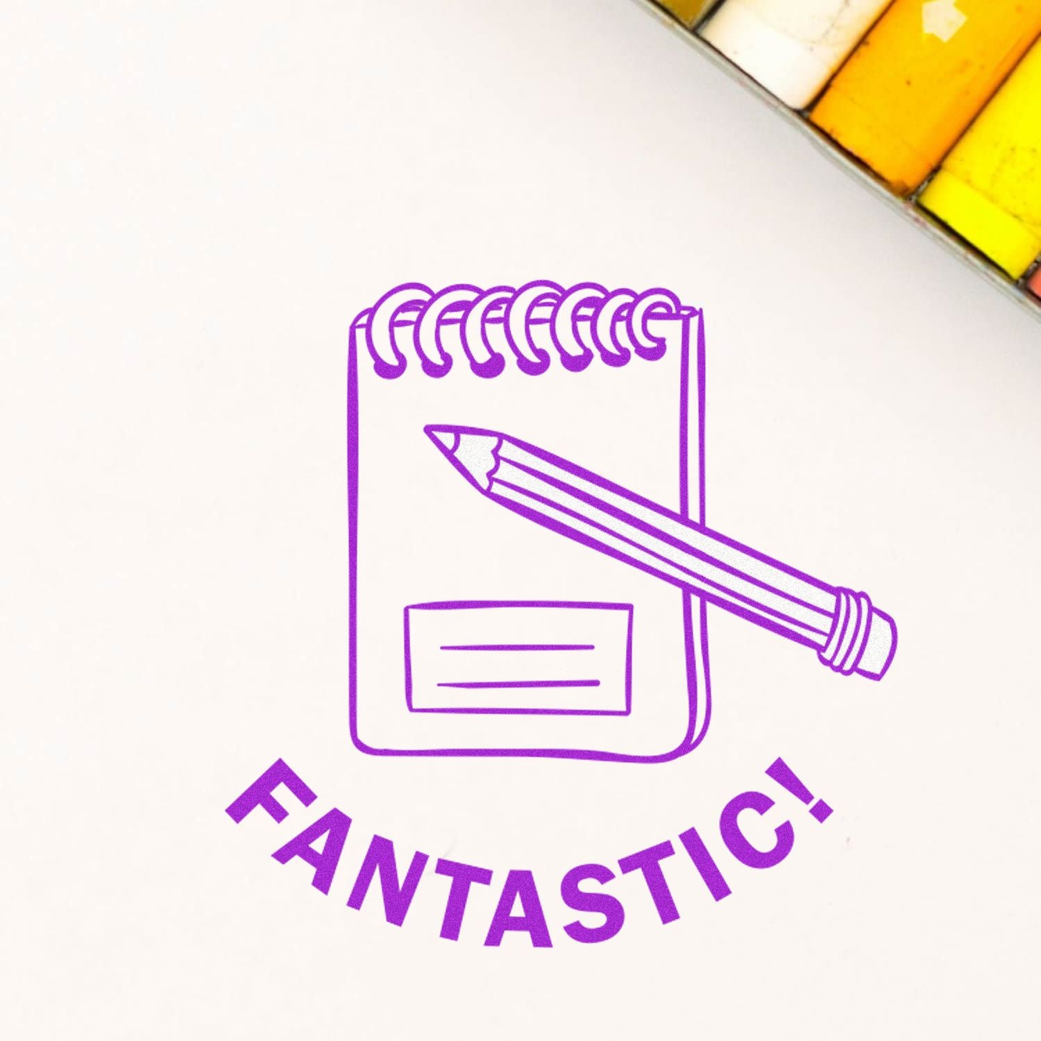 Round Fantastic Rubber Stamp in purple ink on paper, featuring a spiral notebook and pencil design with the word FANTASTIC!