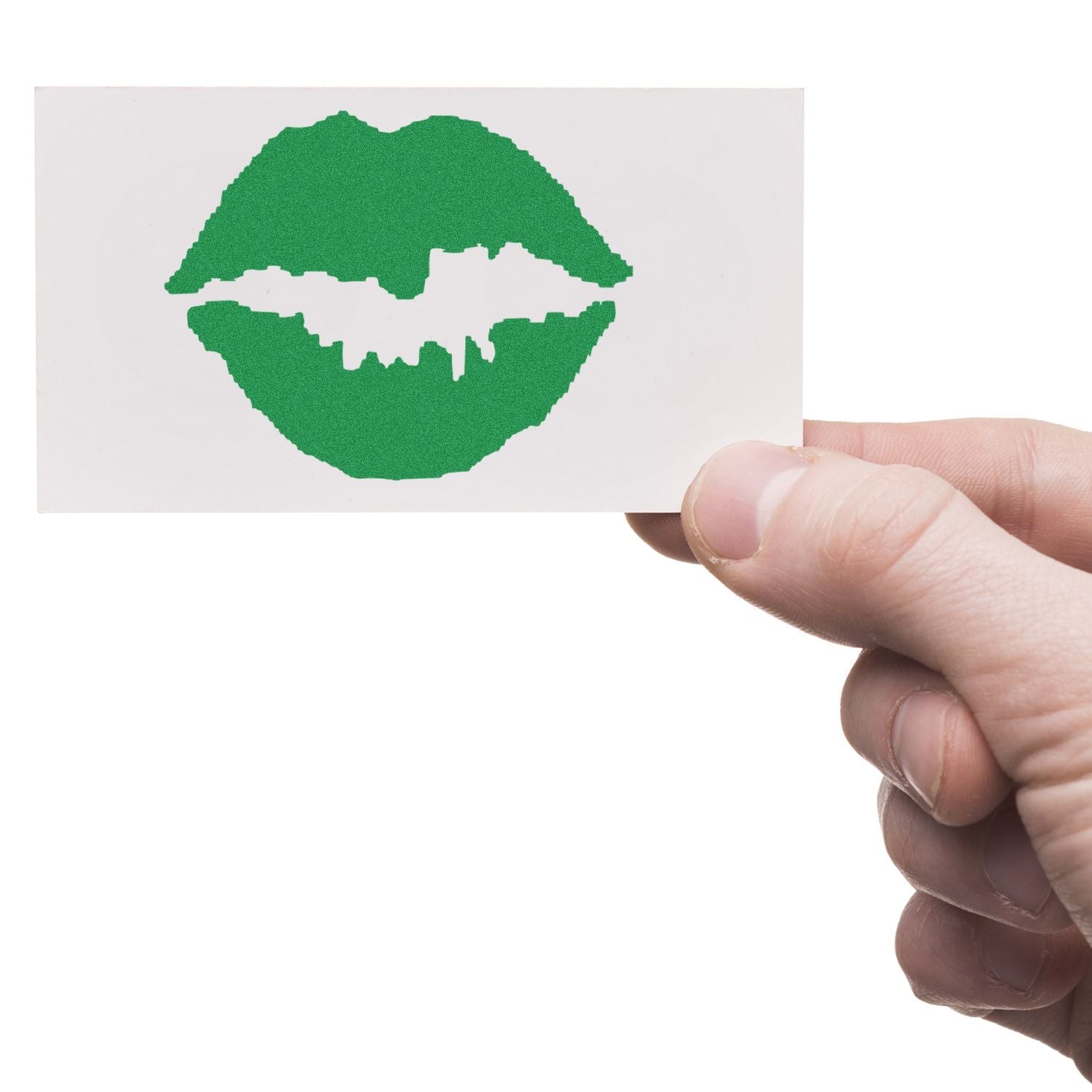 A hand holding a card stamped with a green kiss mark using the Self Inking Round Kiss Stamp.