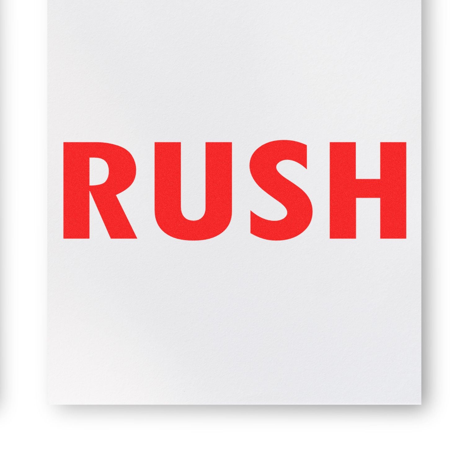 Large Pre-Inked Rush Stamp imprint in bold red letters on white paper, emphasizing urgency and importance.