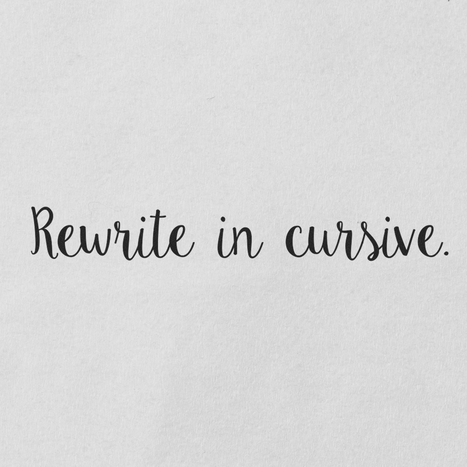 Text 'Rewrite in cursive.' stamped on white paper using the Large Script Rewrite in Cursive Rubber Stamp.