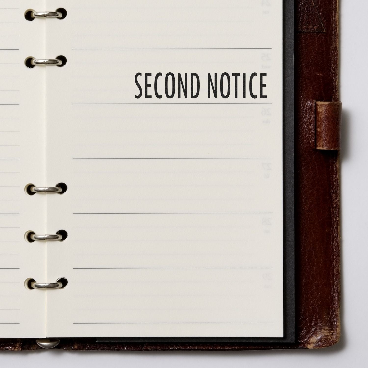 Large Second Notice Rubber Stamp used on a lined notebook page, clearly marking SECOND NOTICE in bold black letters.