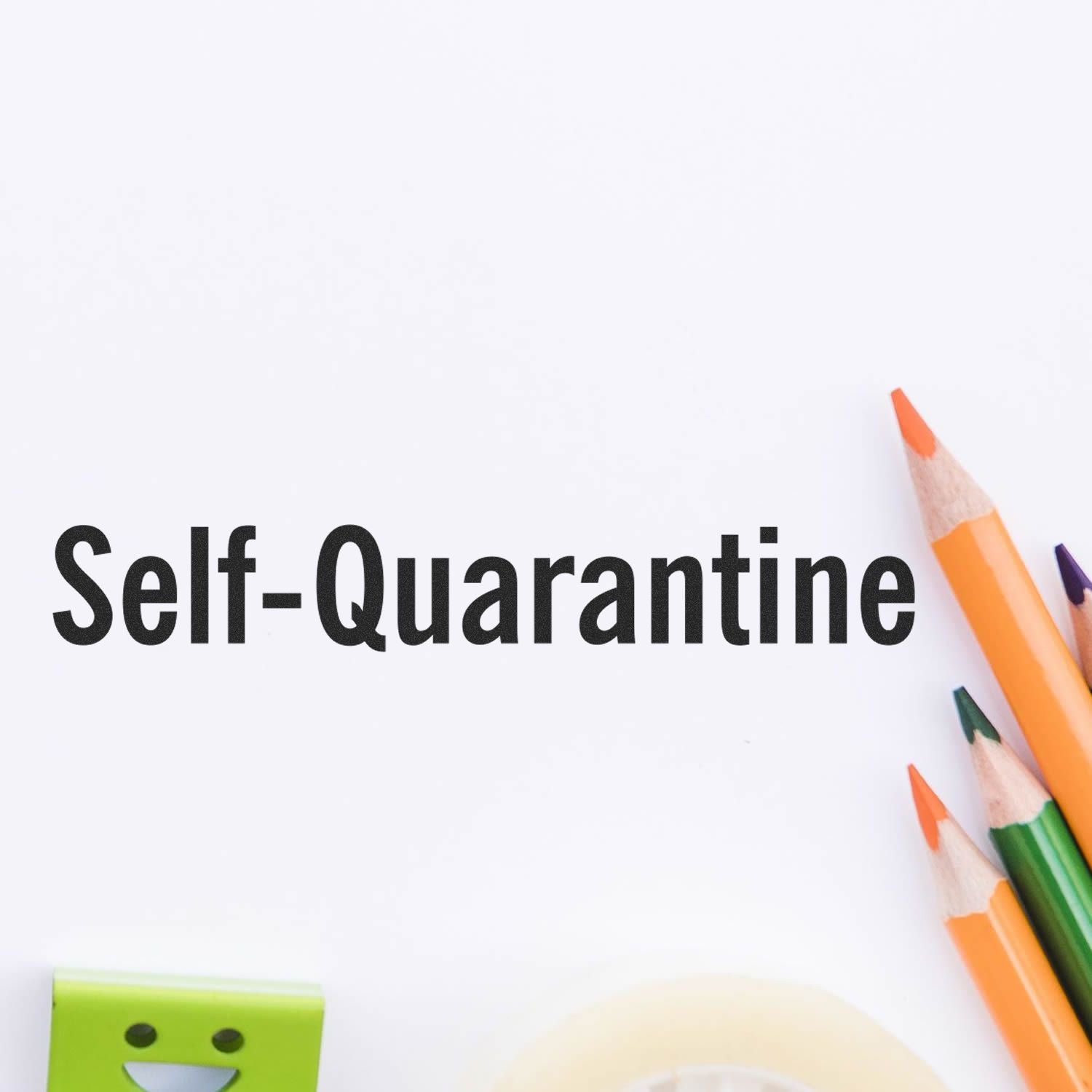 Self-Quarantine Rubber Stamp impression on white paper with colored pencils and office supplies nearby.