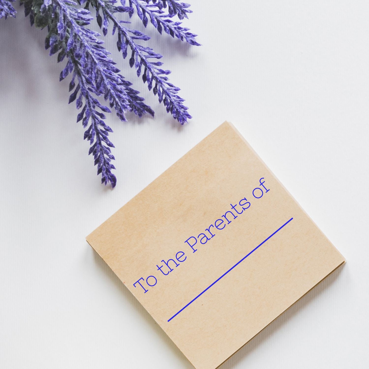 Skinny To the Parents of Rubber Stamp on a brown card with purple lavender flowers on a white background.