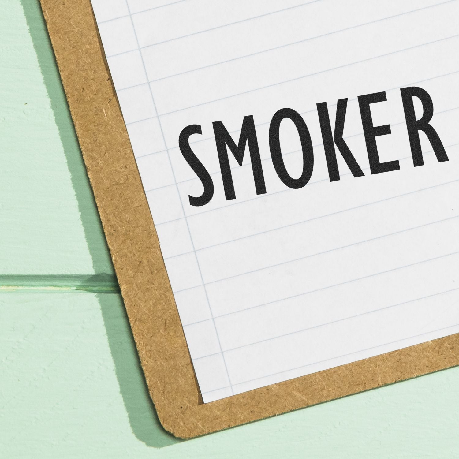 Medical Provider Smoker Rubber Stamp imprint on a lined paper attached to a clipboard.