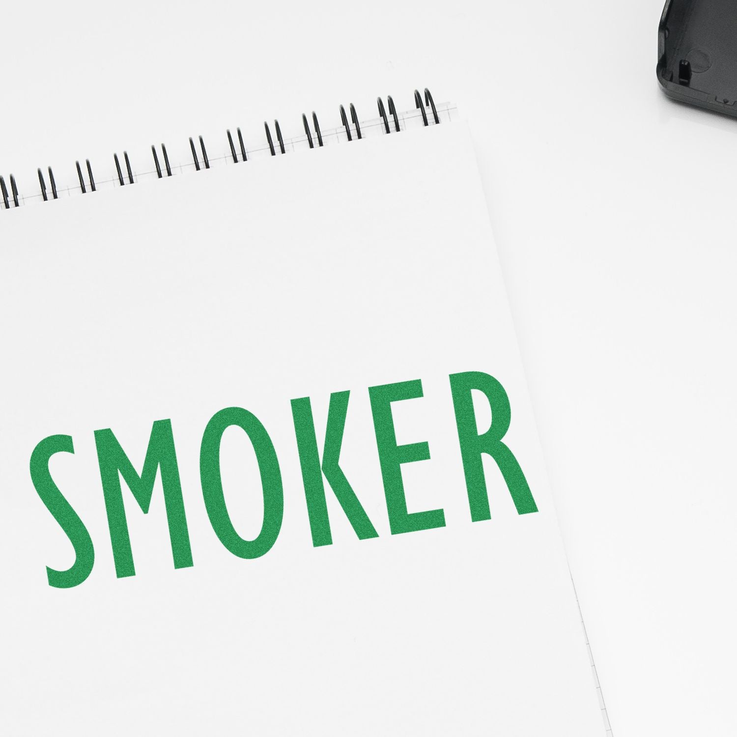 Medical Provider Smoker Rubber Stamp imprint on a white notepad with green text reading 'SMOKER' next to a black ink pad.