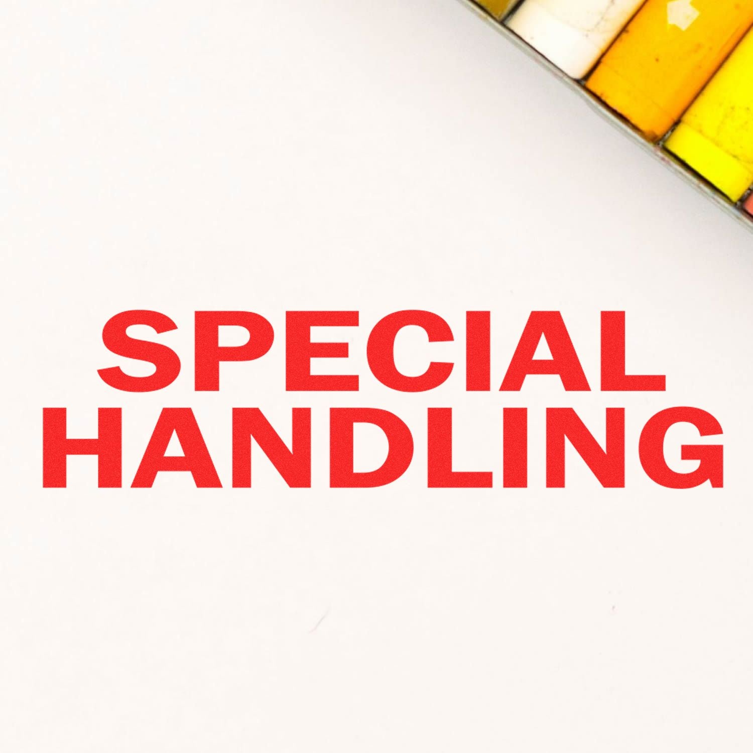 Red 'SPECIAL HANDLING' text stamped on white paper using the Large Self Inking Special Handling Stamp, with colored markers in the background.