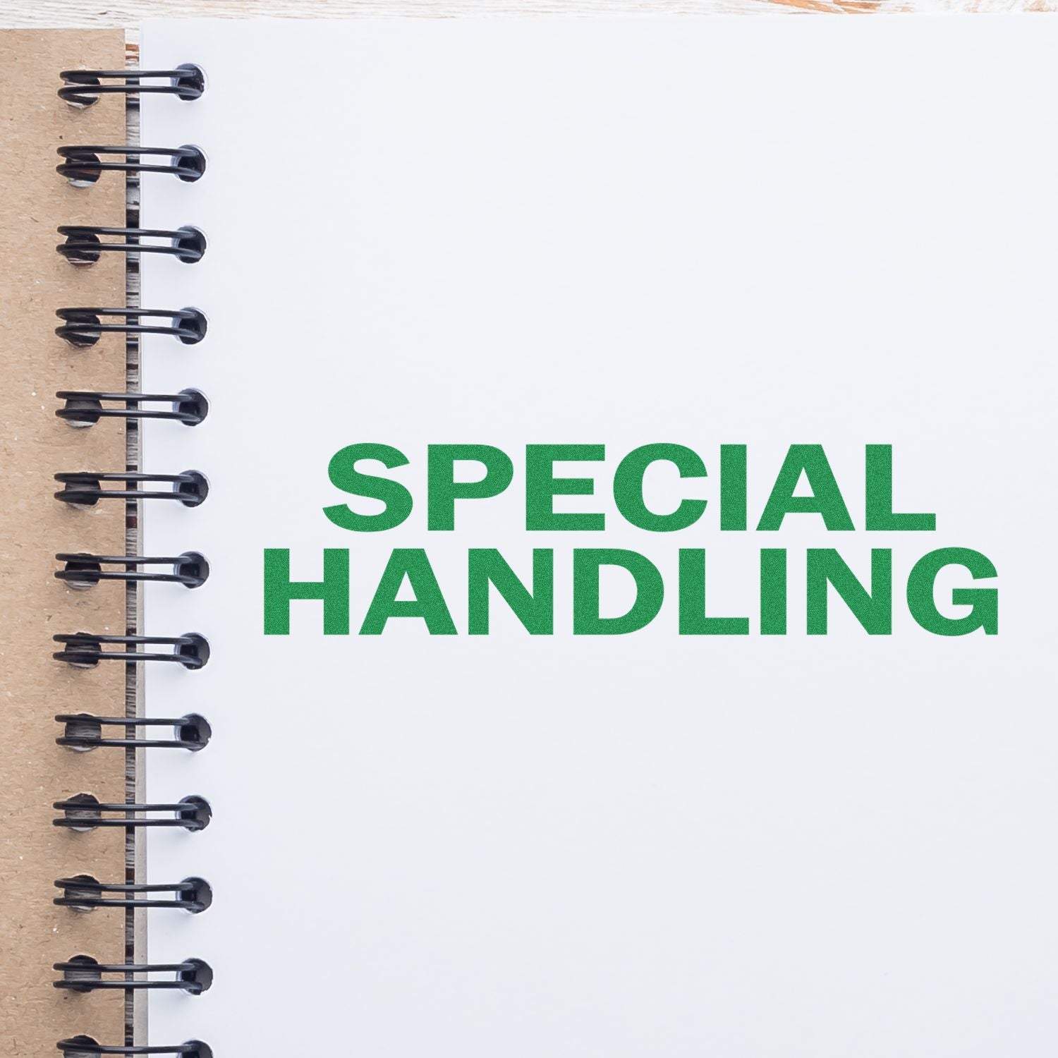 Self Inking Special Handling Stamp used on a white notebook page with green SPECIAL HANDLING text. Spiral binding visible on the left.