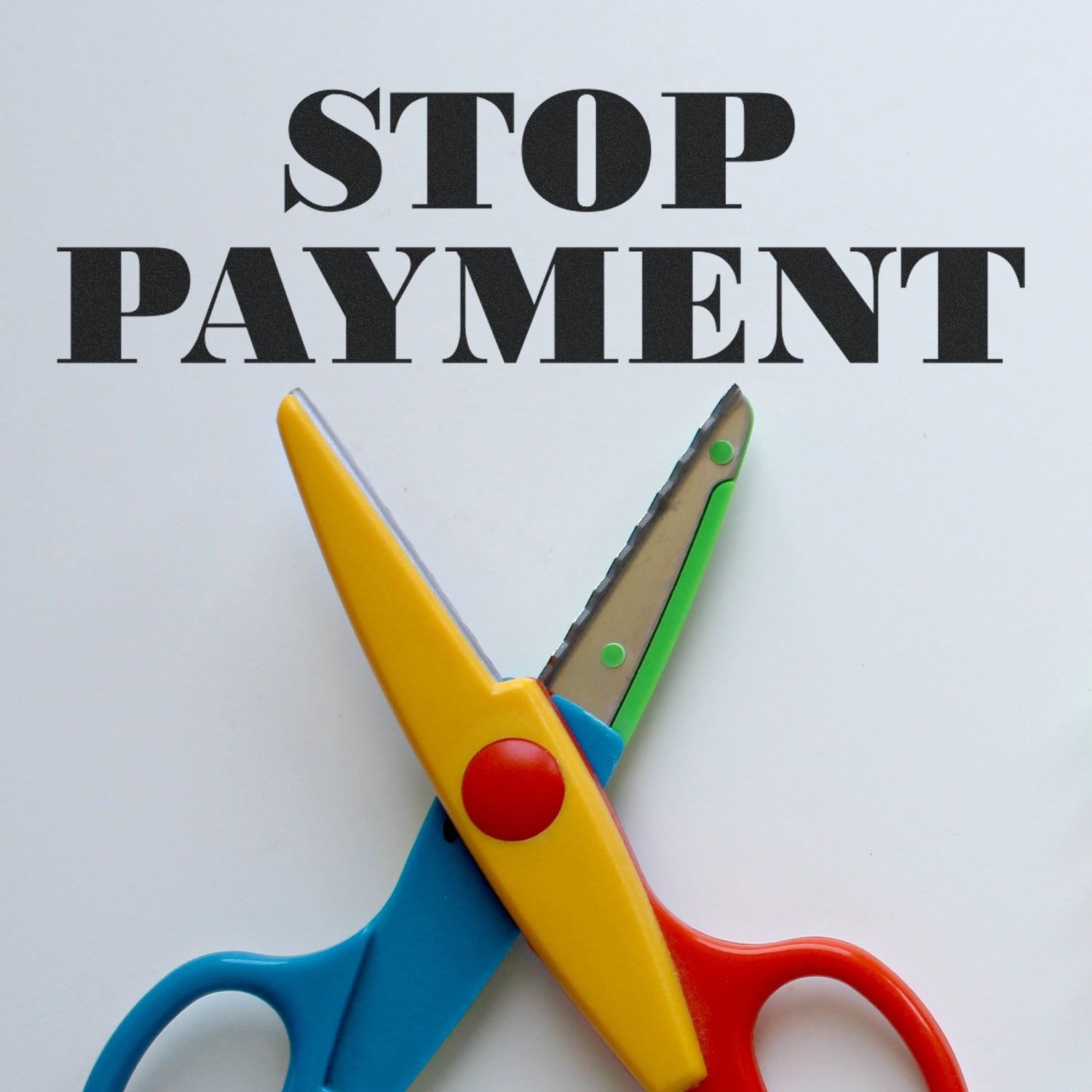 Large Self Inking Stop Payment Stamp in use, with the words STOP PAYMENT stamped in bold black letters above a pair of colorful scissors.