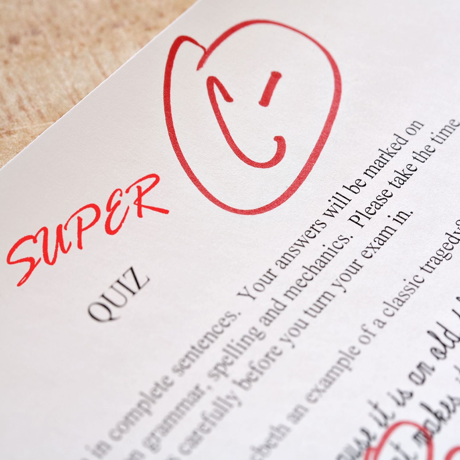 Paper with a red C grade and SUPER stamped on it using a Super Rubber Stamp, highlighting feedback on a quiz.