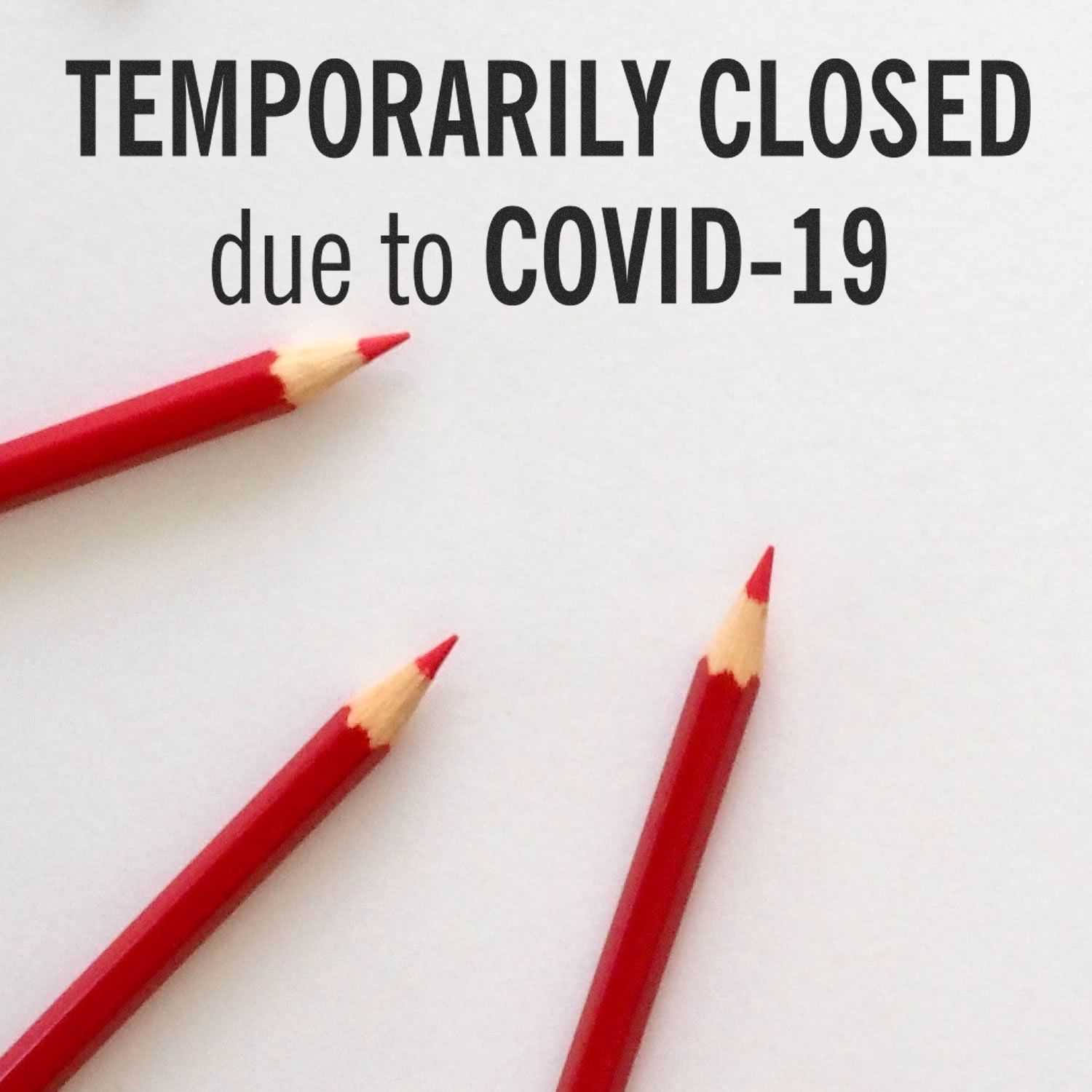 Temporarily Closed Rubber Stamp with red pencils on a white background, indicating closure due to COVID-19.