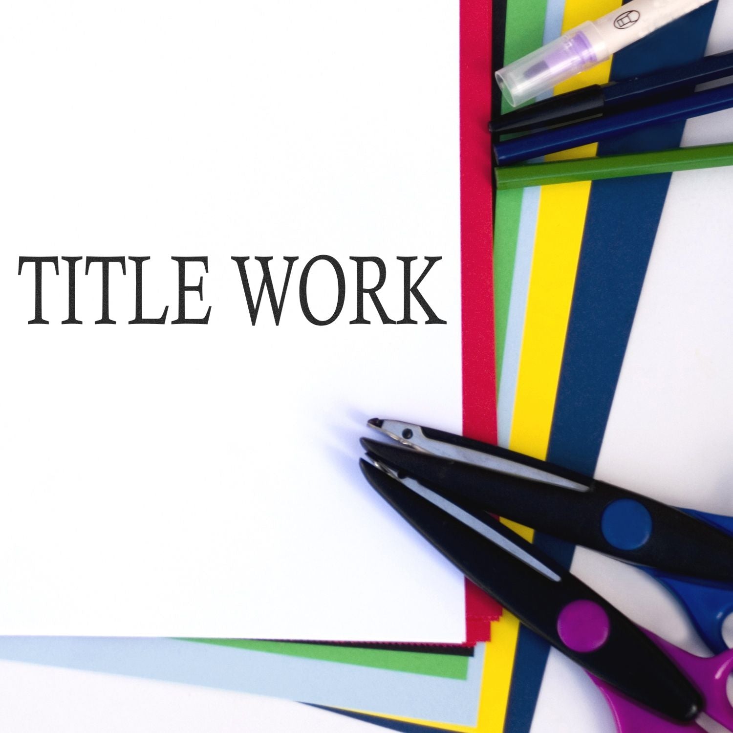 Large Title Work rubber stamp on white paper with colorful sheets, scissors, and pens in the background.