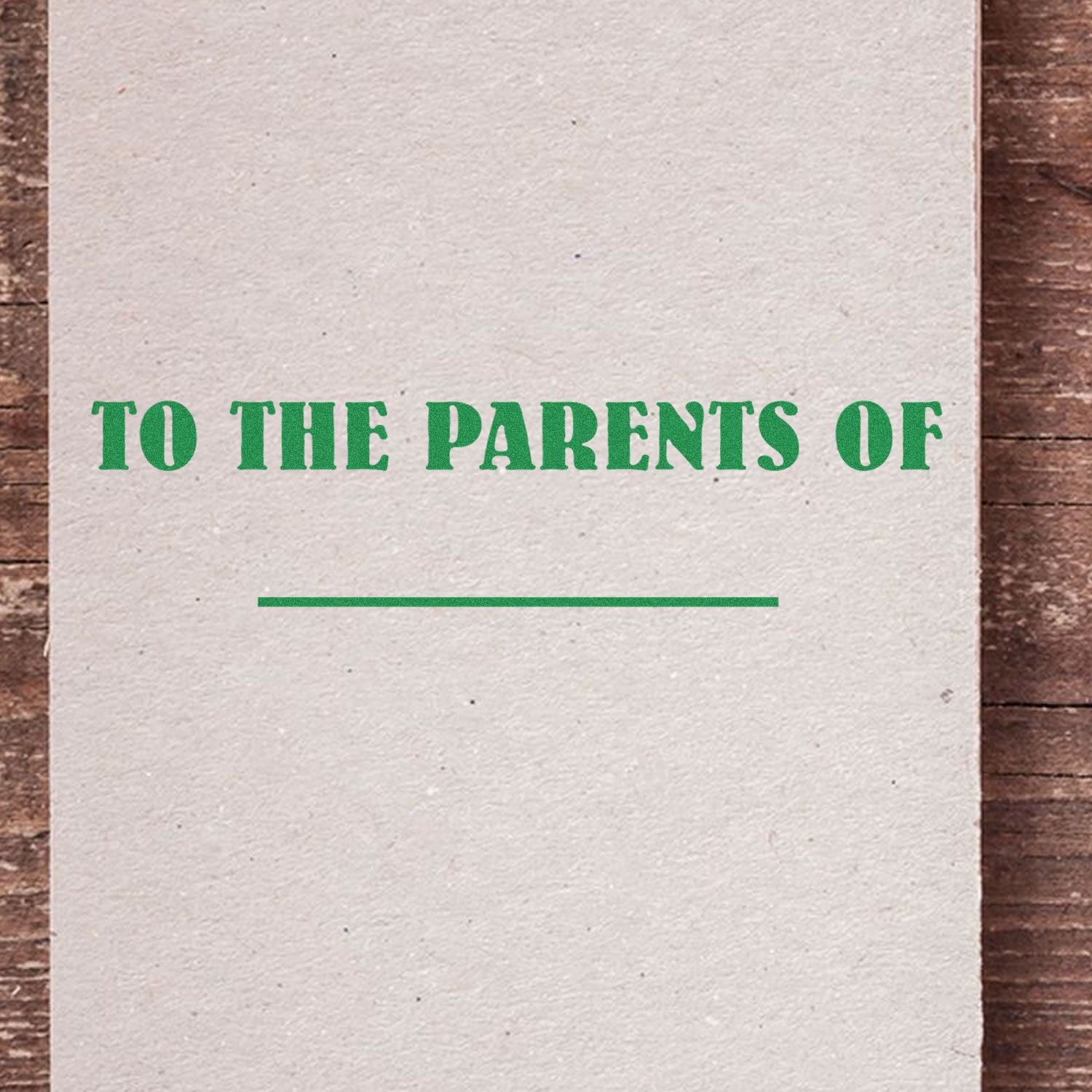 To The Parents Of rubber stamp on a textured paper background with a blank line for customization.