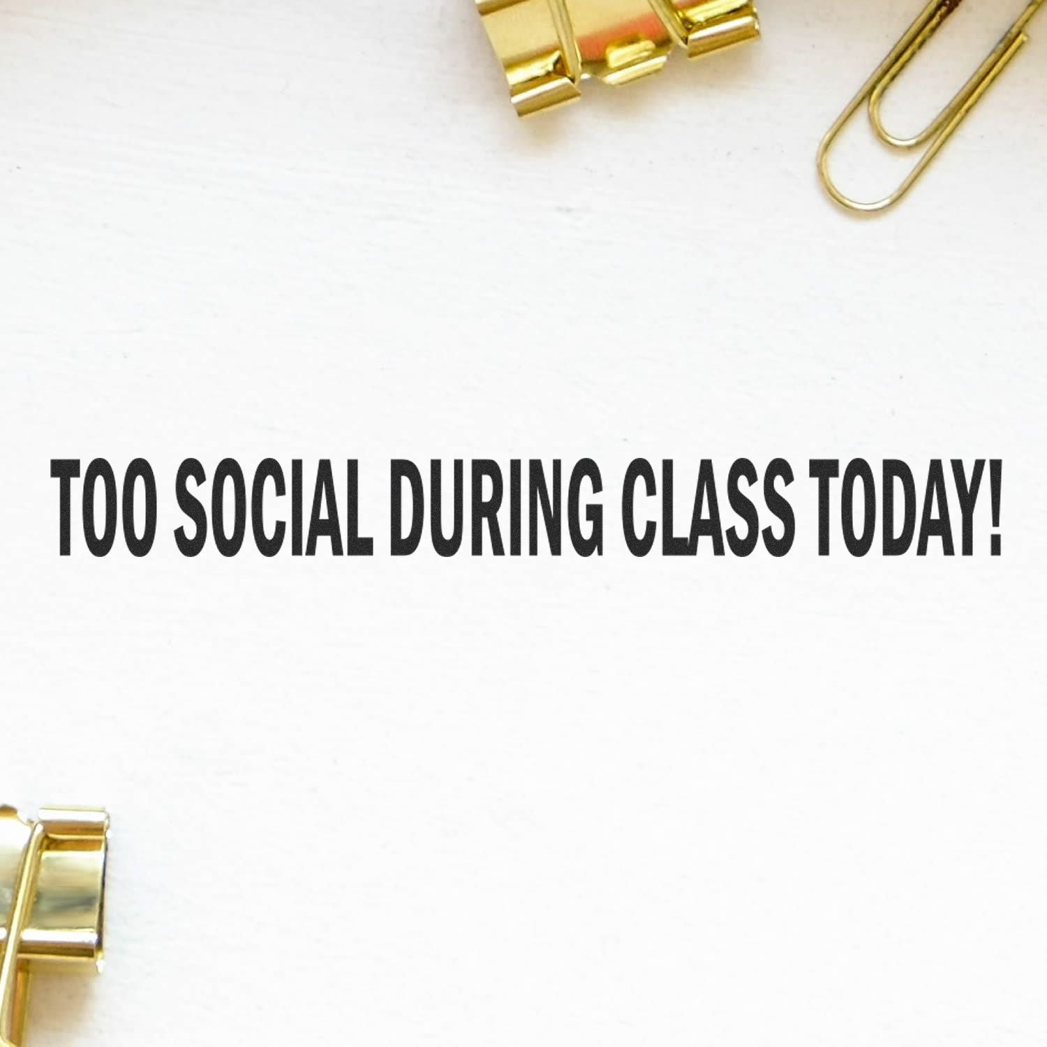 Too Social During Class Today rubber stamp impression on white paper, surrounded by gold paper clips and binder clips.