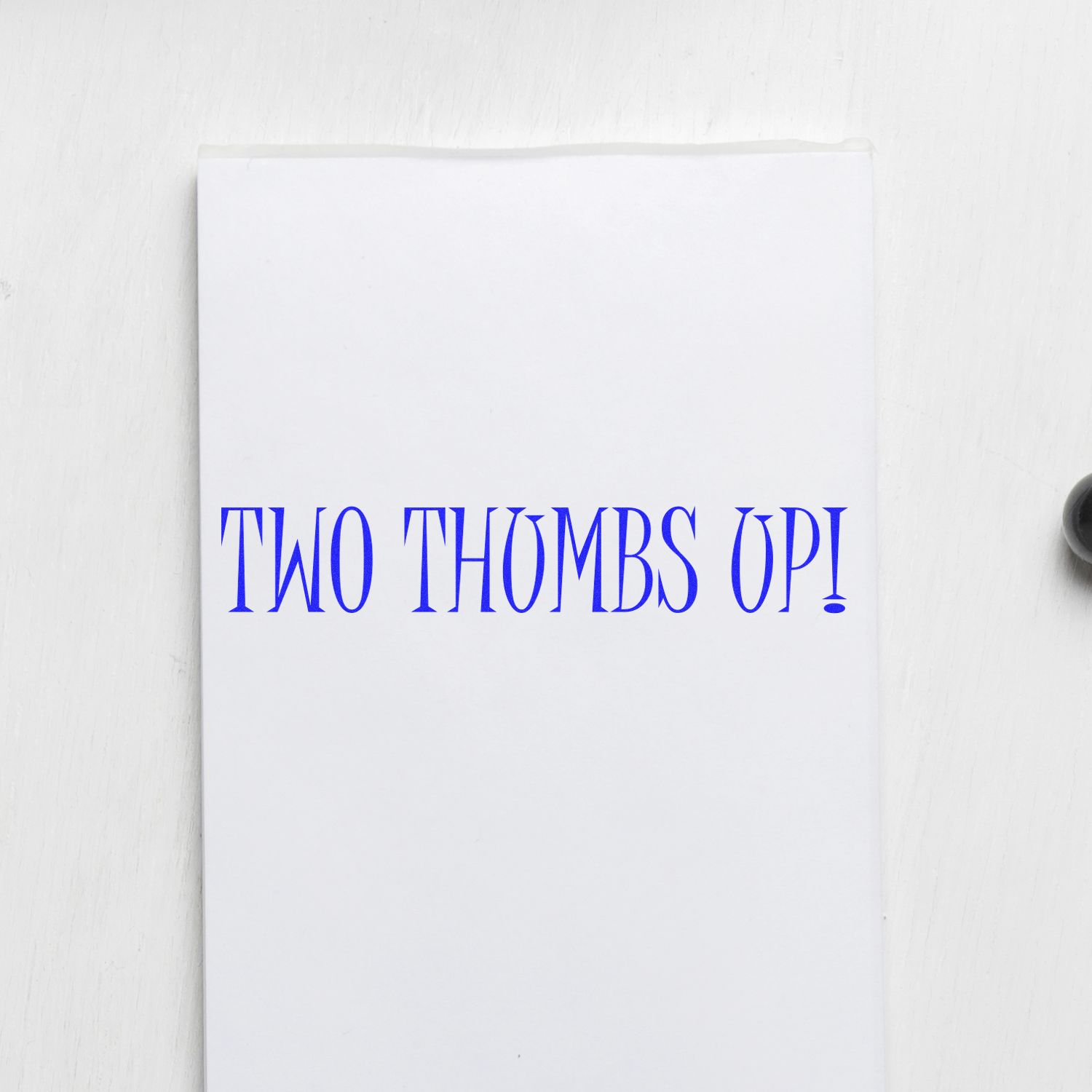 Large Two Thumbs Up Rubber Stamp imprint on white paper with bold blue text reading TWO THUMBS UP!