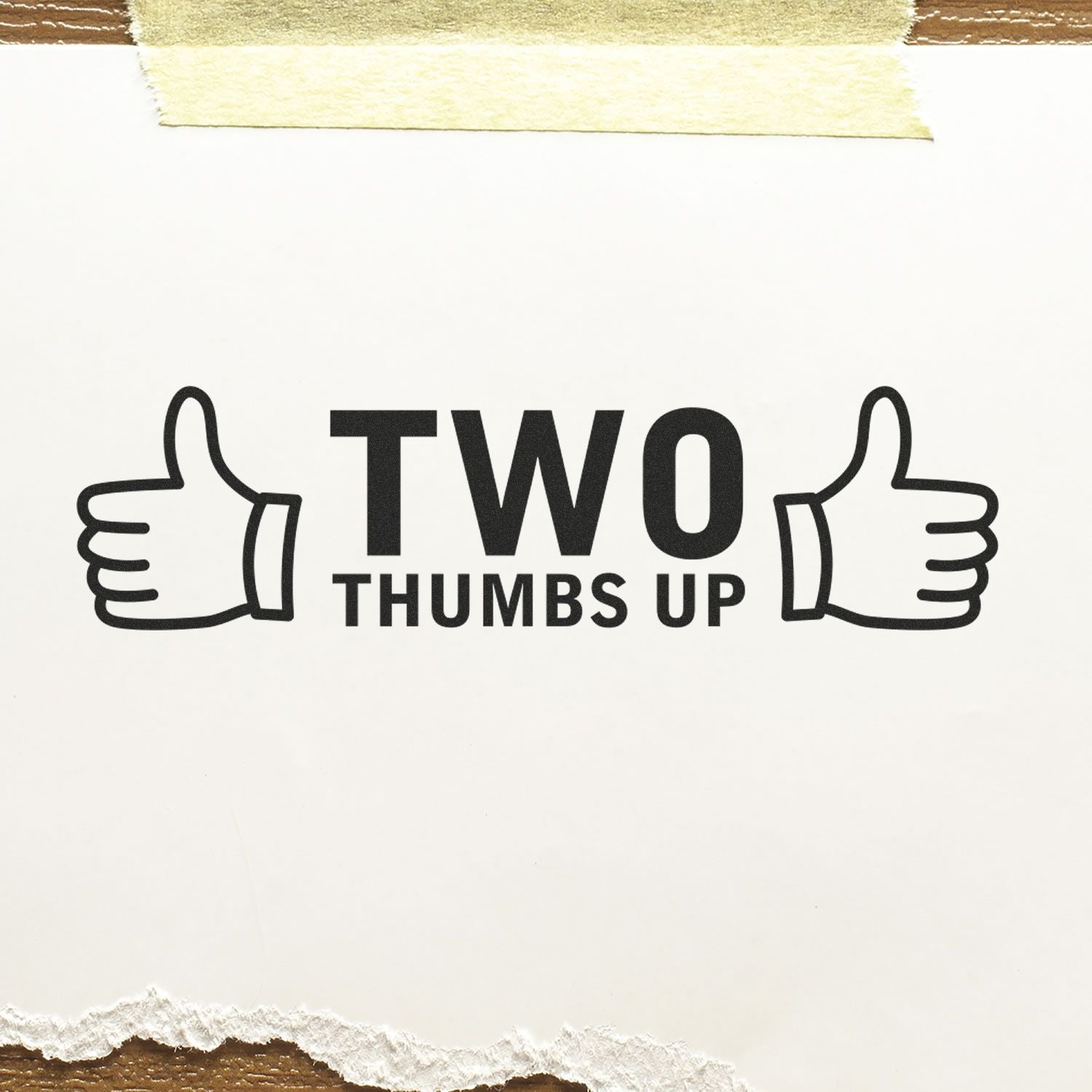 Large Self Inking Two Thumbs Up with Thumb Icon Stamp used on paper, displaying two thumbs up icons and the text 'TWO THUMBS UP'.