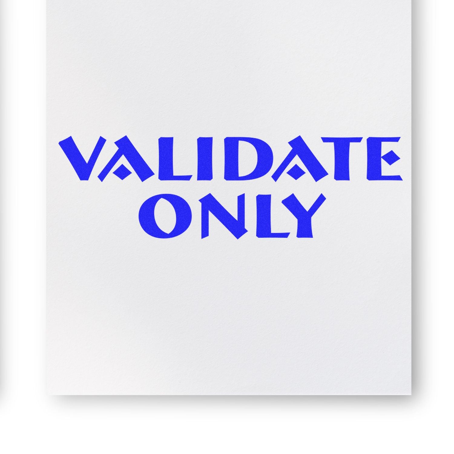 Blue 'VALIDATE ONLY' text stamped on white paper using the Validate Only Rubber Stamp.