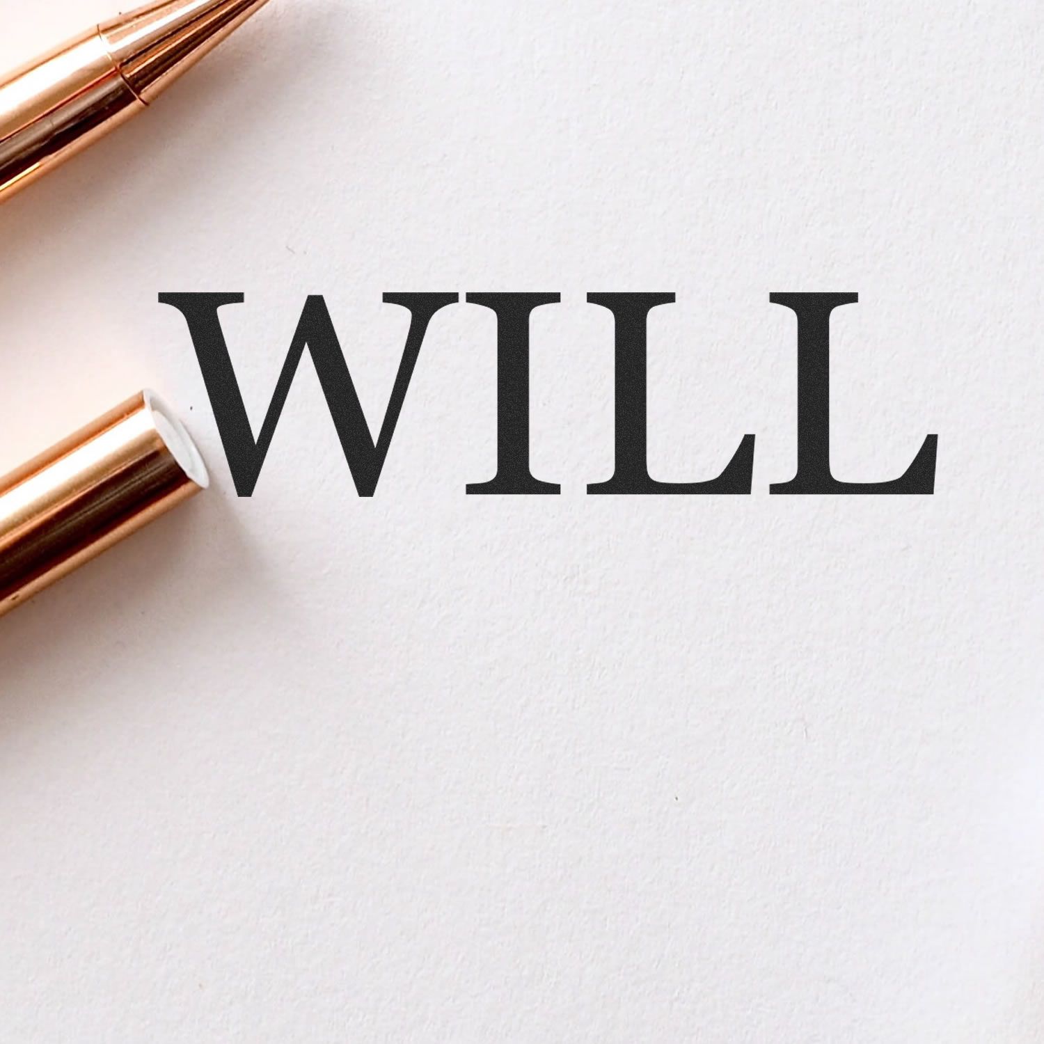 Large Self Inking Will Stamp imprinting the word 'WILL' in bold black letters on white paper, with a gold pen nearby.