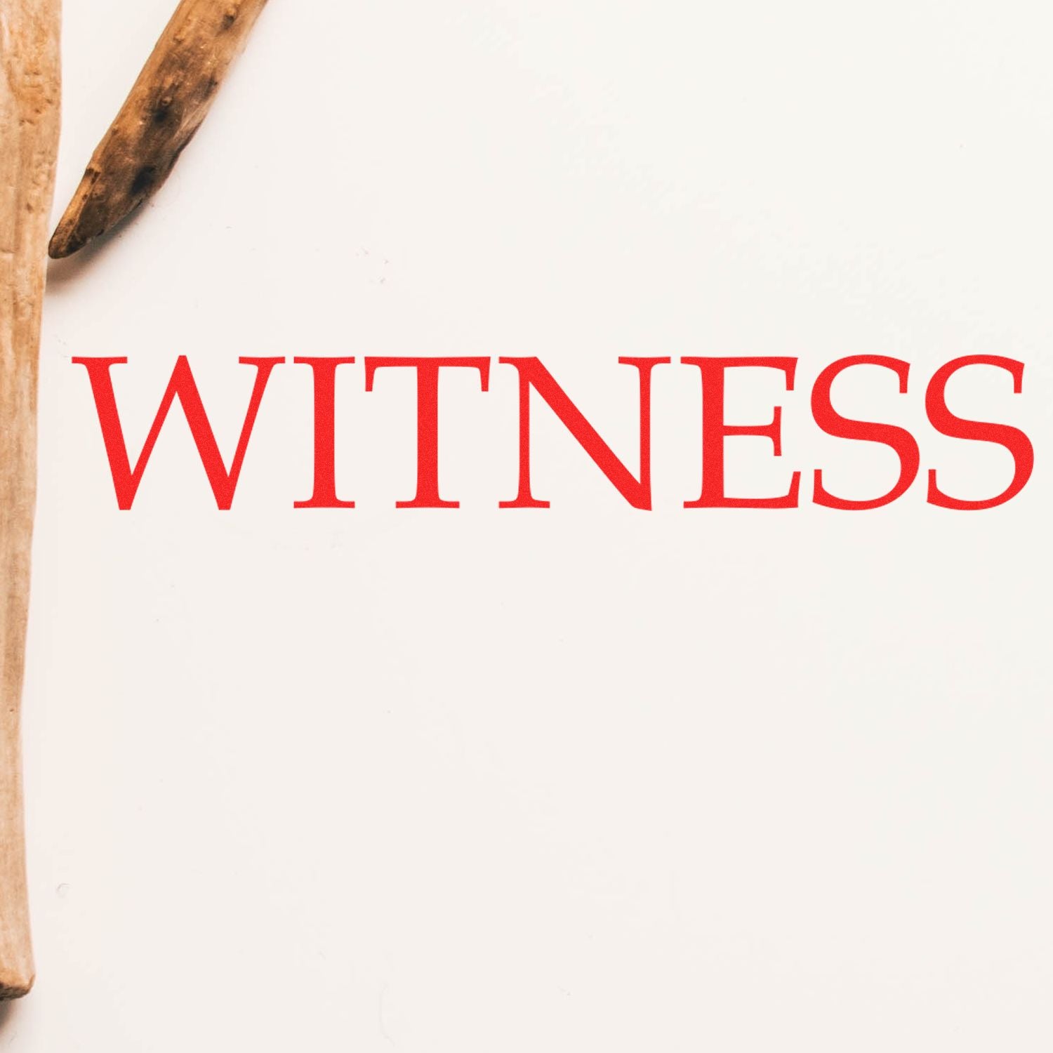 Large Pre-Inked Witness Stamp in use, displaying the word WITNESS in bold red letters on a white background with wooden objects nearby.