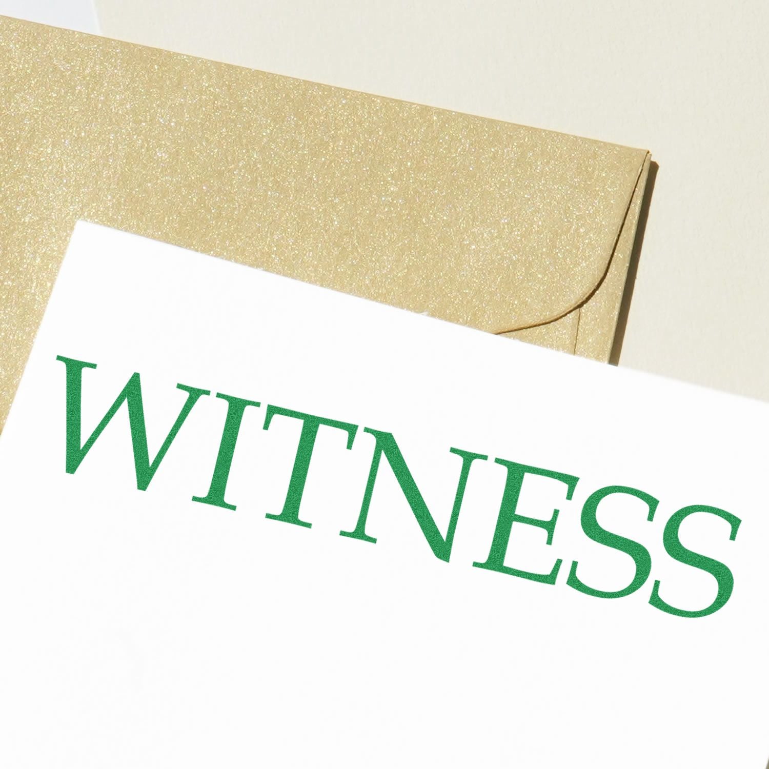 Legal Witness Rubber Stamp in green ink on white paper, with a golden envelope in the background.