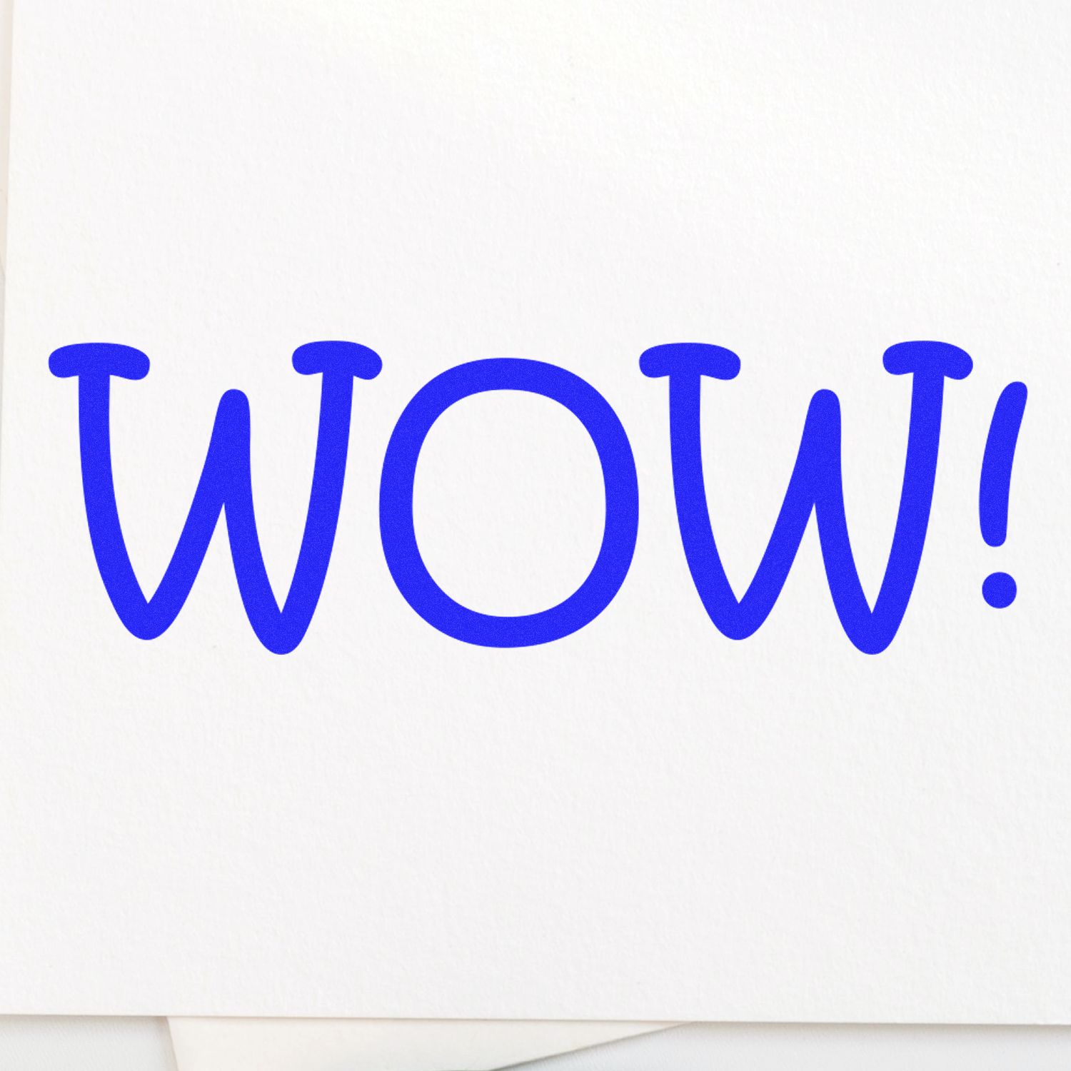 Teacher WOW Rubber Stamp in blue ink on white paper, displaying the word 'WOW!' in bold, playful letters.