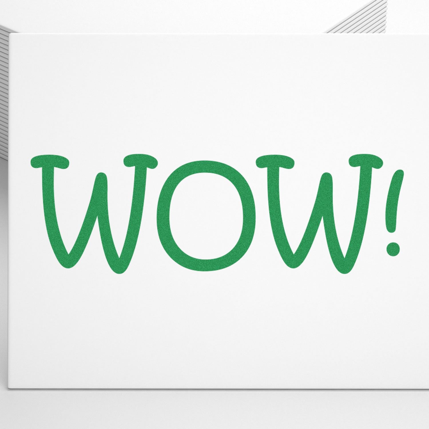 Large Pre-Inked Wow Stamp in green ink on white paper, displaying the word WOW! in bold, playful font.