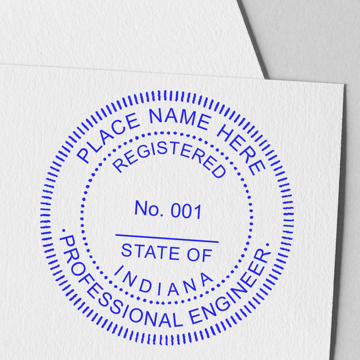 An alternative view of the Indiana Professional Engineer Seal Stamp stamped on a sheet of paper showing the image in use